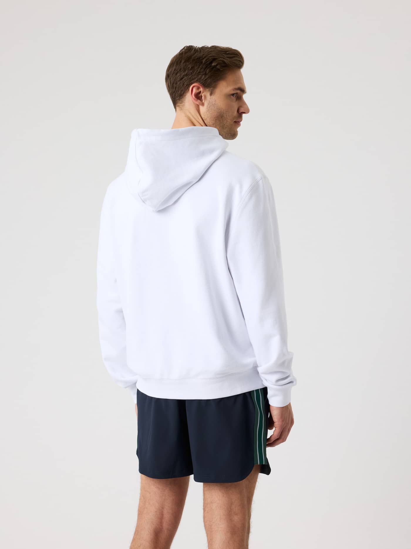 Back view of a man wearing the cotton Borg Classic Print Hoodie in Brilliant White (White) for tennis style and performance. - Image 4