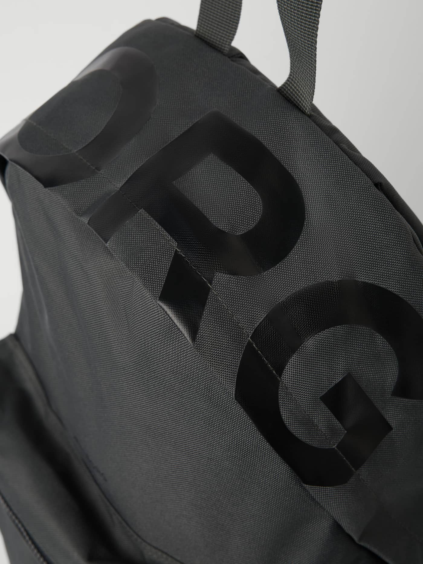 Borg Logo Backpack 19L in Forest Night (Green) with a black logo, showing the durable woven training fabric detail. - Image 4