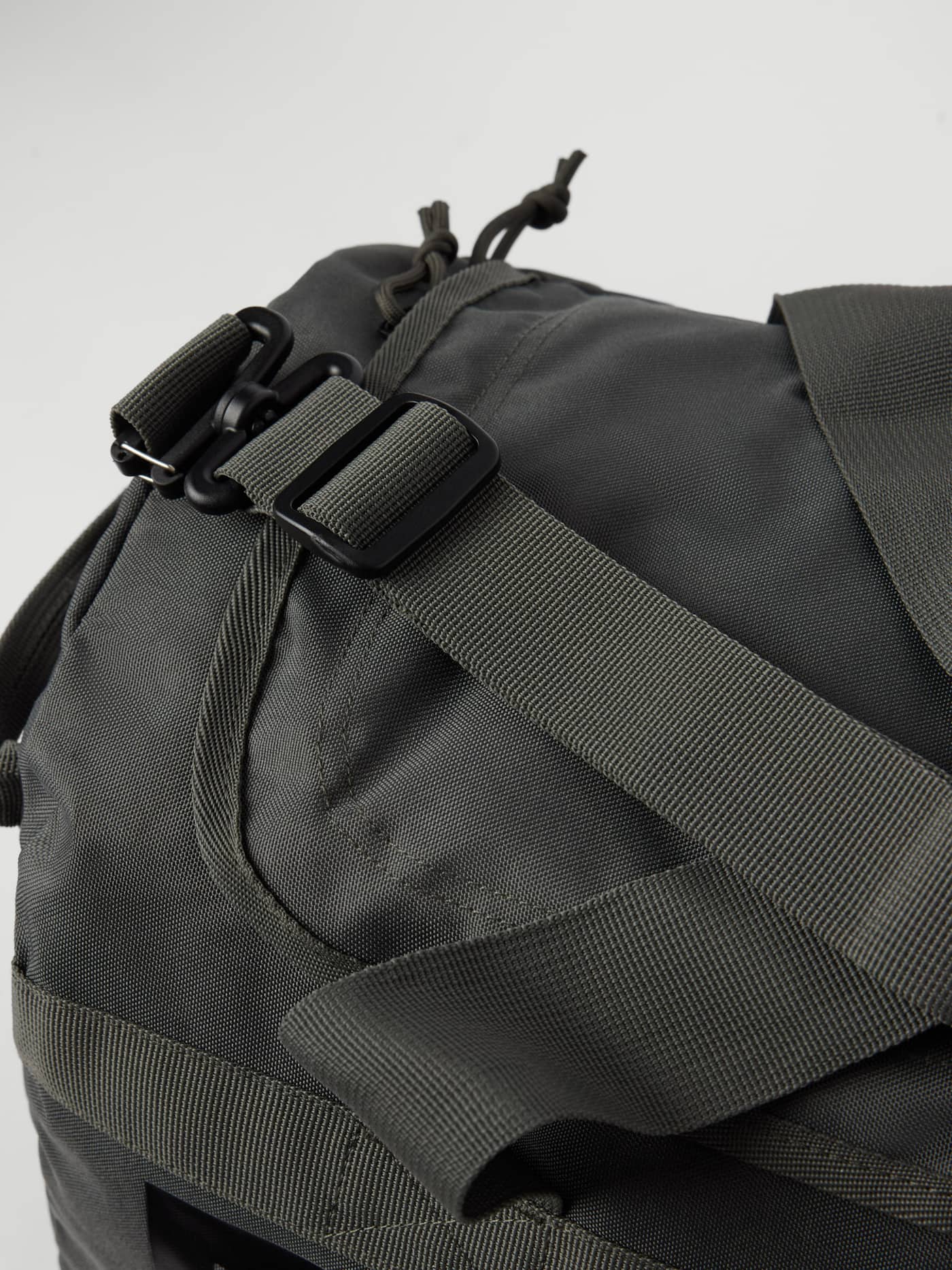 Close-up of the Borg Logo Sports Bag 40L in Forest Night (Green) showing the durable strap and training buckle. - Image 3