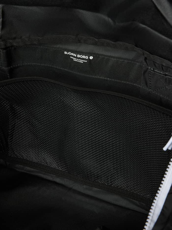 Interior view of the Borg Logo Sports Bag 42L in Black Beauty (Black) with a mesh pocket and white logo.