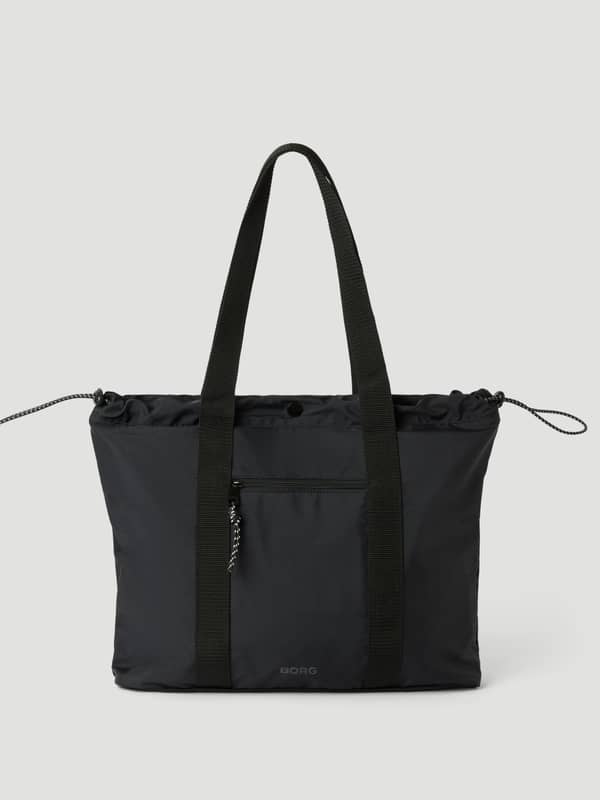 Vue de face du Studio Active Tote 18L en Black Beauty (Noir), un sac d'entraînement en polyester recyclé.