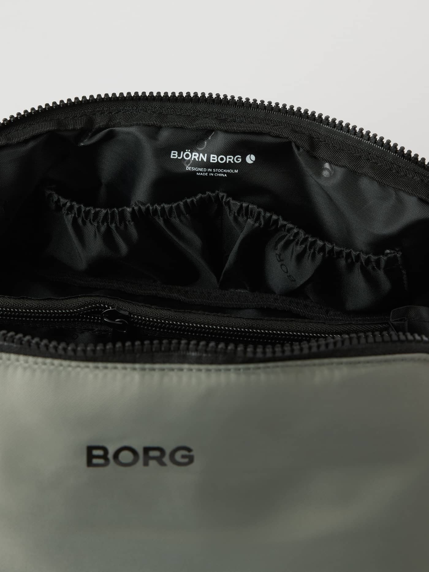 Borg Classic Wash Bag in Agave Green (Green) for training, showing the open interior and organized pockets. - Image 3