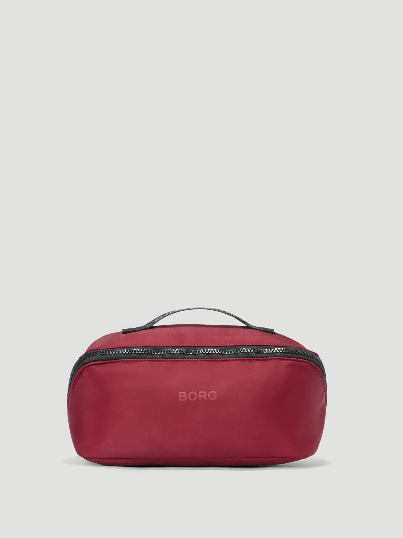 Borg Classic Wash Bag in Cabernet (Red) for training, featuring a top handle, zip closure, and tone-on-tone logo. - Image 1