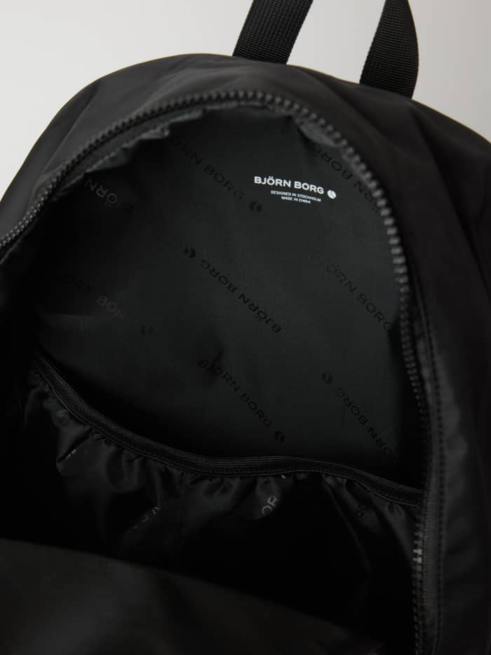 Interior view of the training Borg Classic Backpack 19L in Black Beauty (Black), showing the branded lining and white logo. - Image 3
