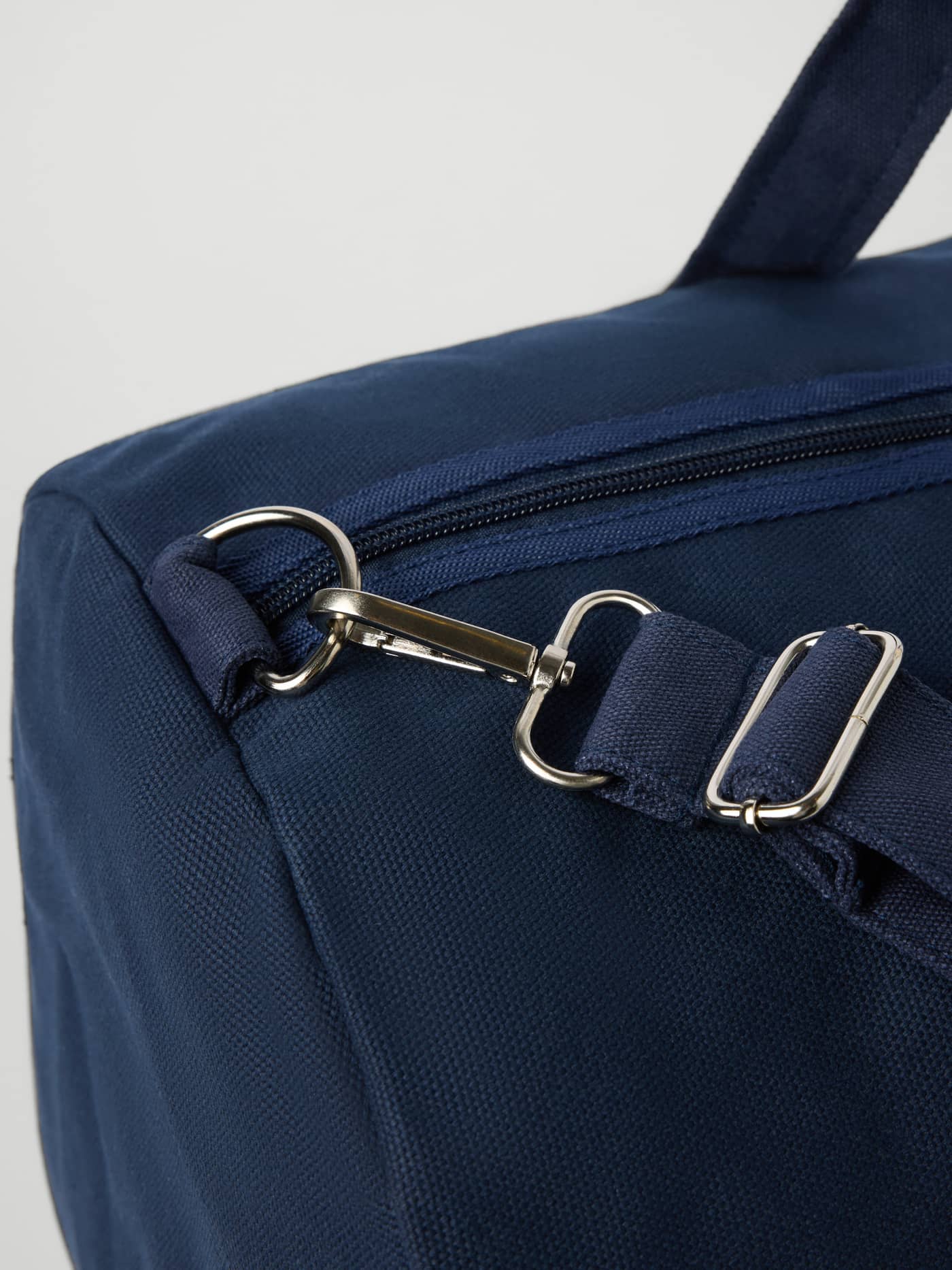 Close-up of Ace Canvas Sports Bag 38L in Night sky (Navy) with durable canvas and silver metal hardware for tennis gear. - Image 3