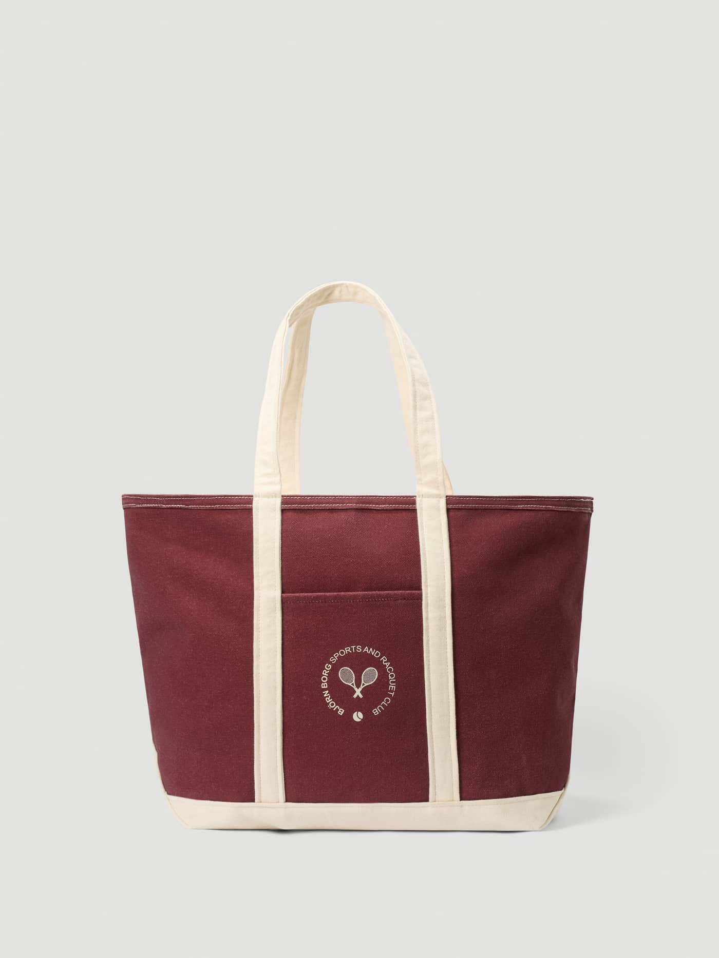 Ace Canvas Tote 27L in Cabernet (Red) in durable cotton canvas with off-white handles and a white tennis logo. - Image 2