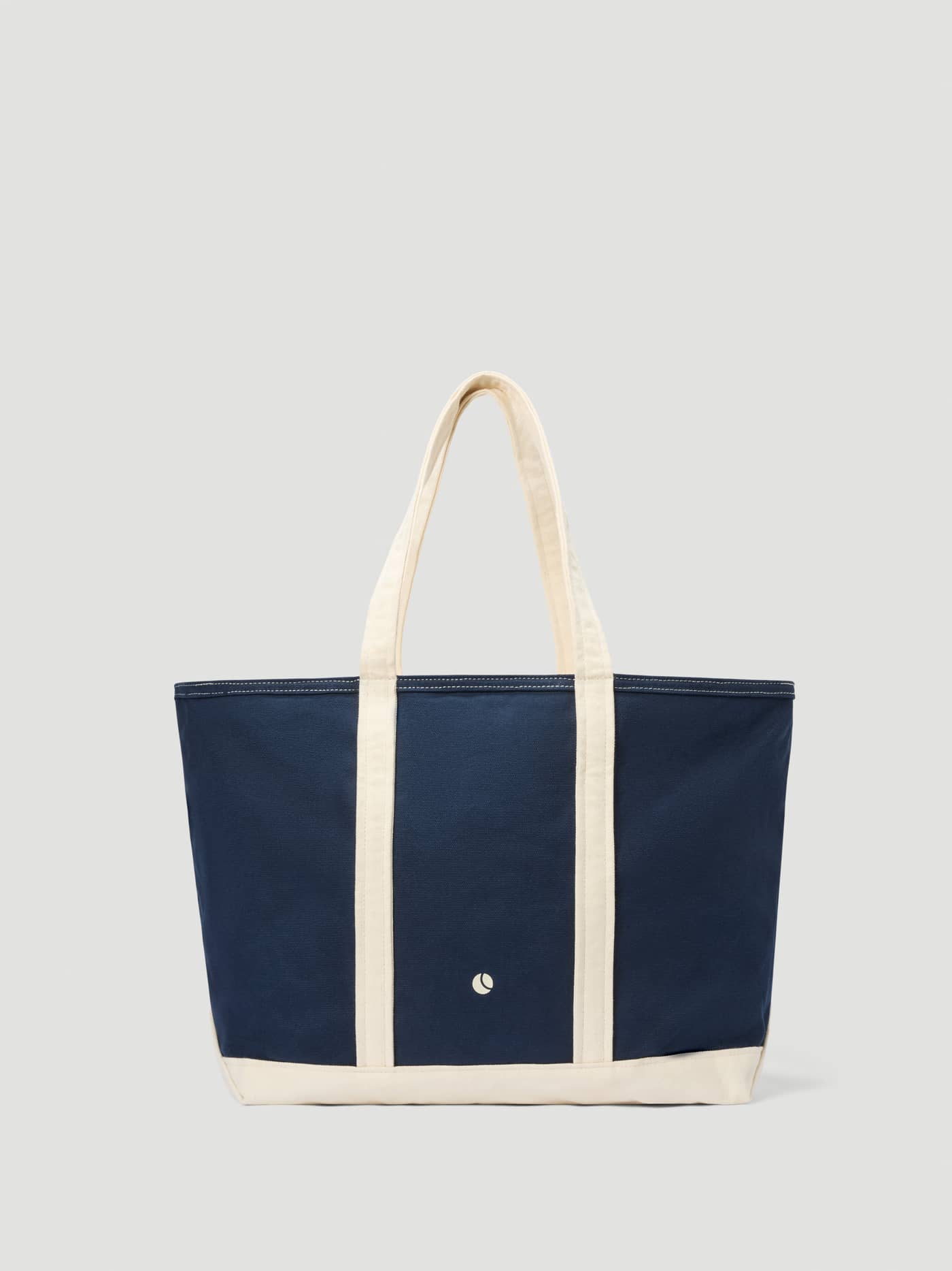 Ace Canvas Tote 27L in Night sky (Navy) made from cotton canvas with cream handles and a white logo, ideal for tennis. - Image 2