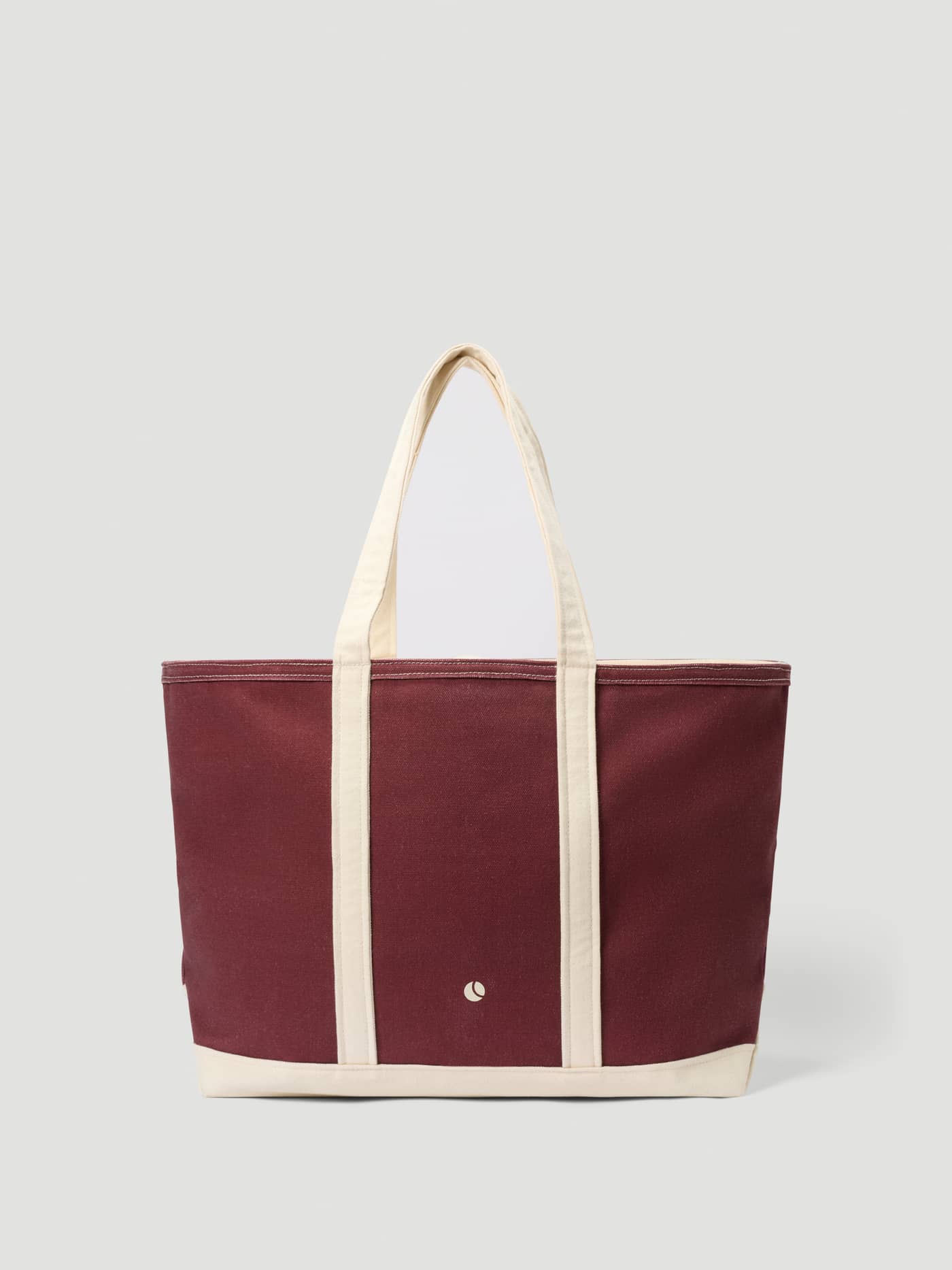 Ace Canvas Tote 27L in Cabernet (Red) features a white logo and durable cotton canvas, ideal for tennis gear. - Image 3