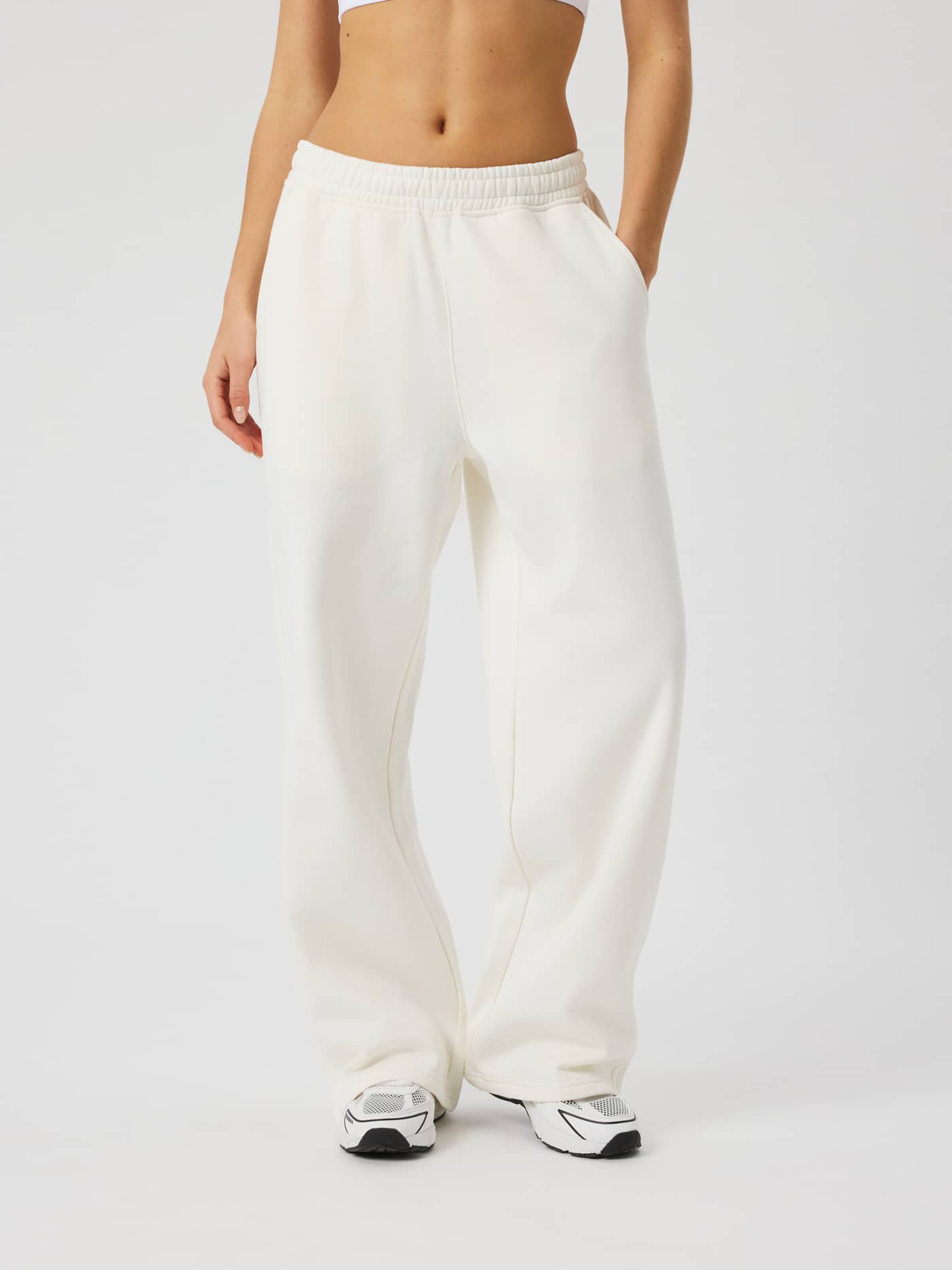 Front view of a model wearing Studio Oversized Straight Sweatpants in Tofu (White) with a relaxed straight-leg fit. - Image 2