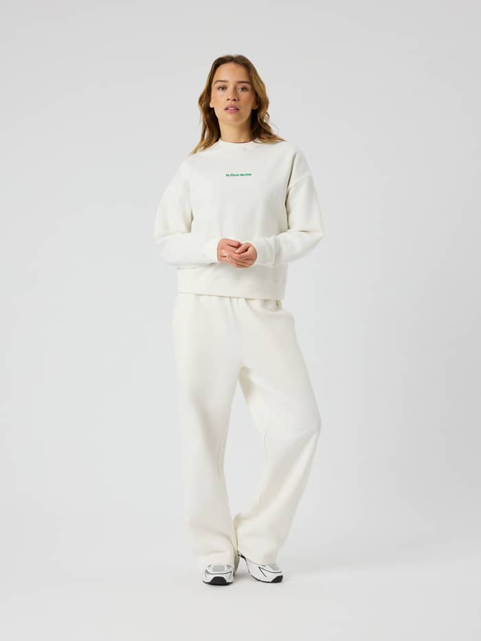 Full-body front view of Studio Oversized Straight Sweatpants in Tofu (White) with a relaxed fit and tennis-inspired style.