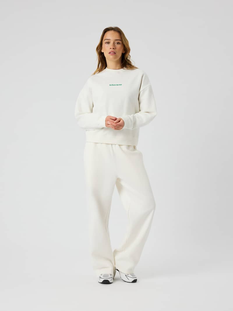 Full-body front view of Studio Oversized Straight Sweatpants in Tofu (White) with a relaxed fit and tennis-inspired style.