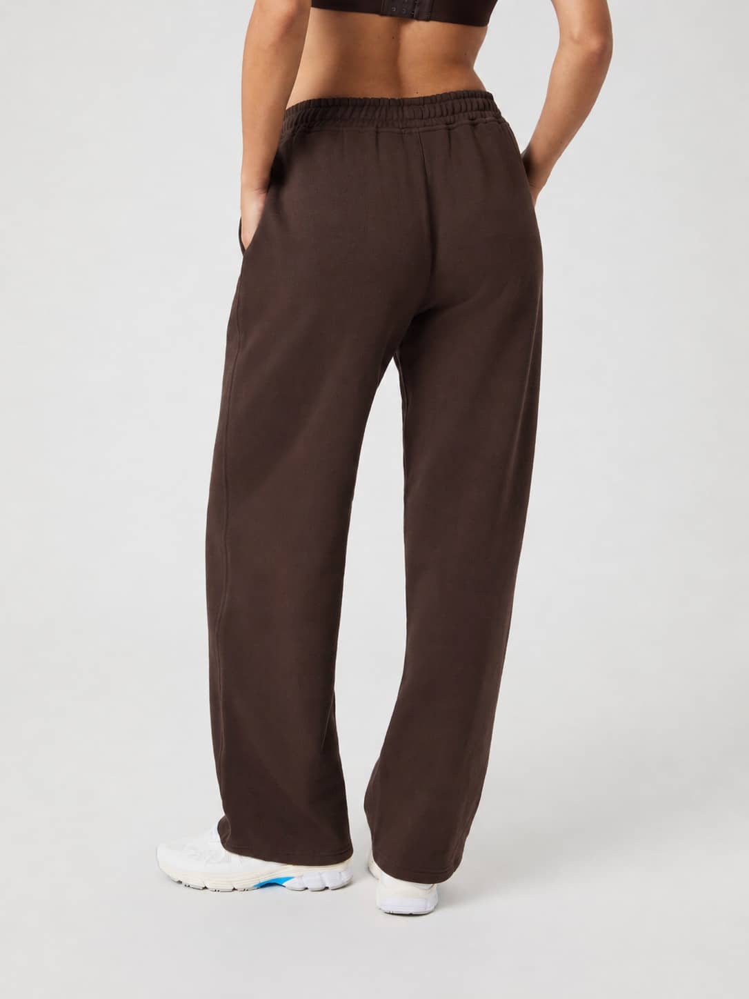 Back view of Studio Oversized Straight Sweatpants in Coffee Bean (Brown) with a straight-leg fit and white tennis ball print. - Image 3