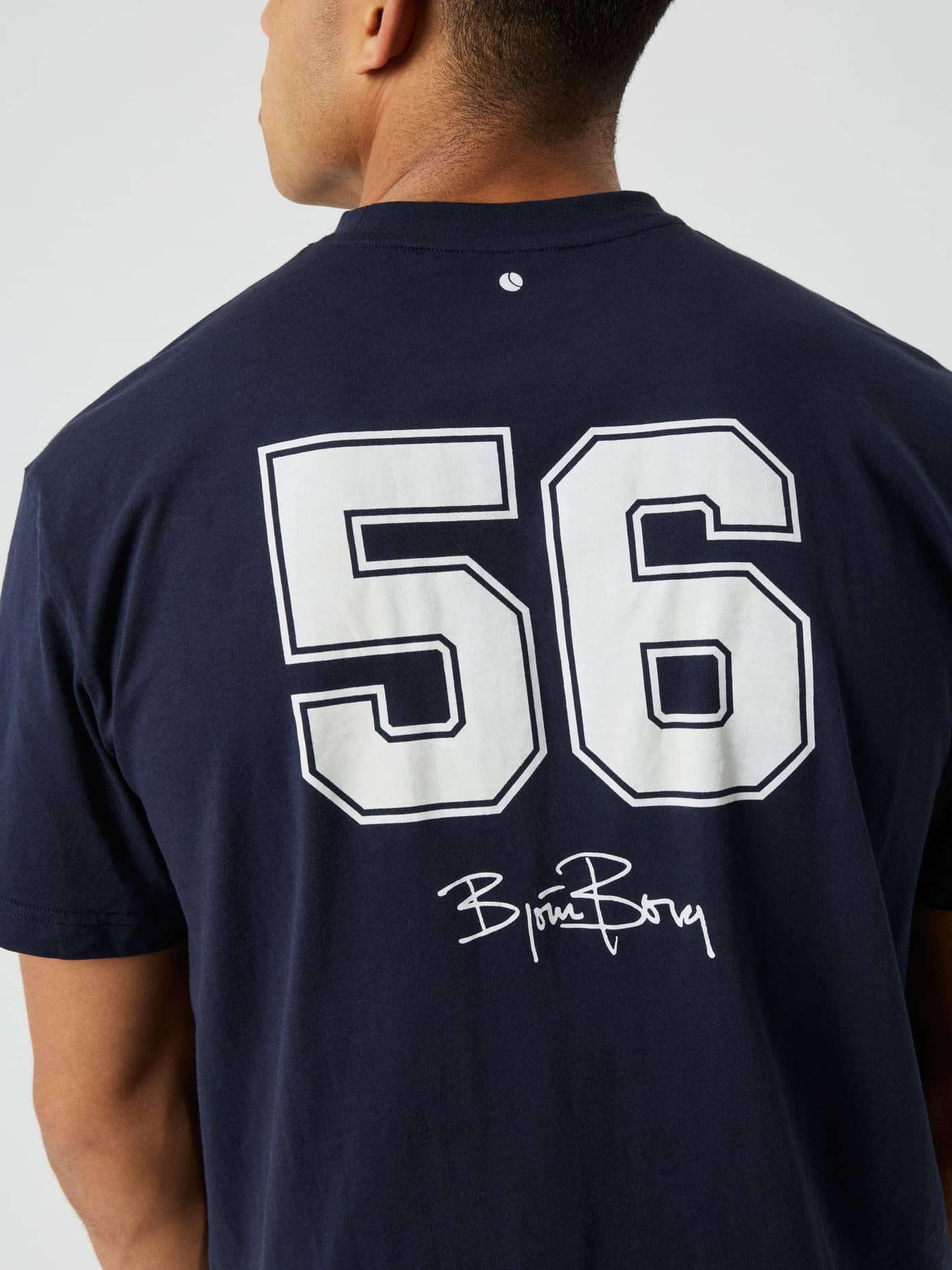 Back view of the Borg Classic Print T-Shirt in Night sky (Navy) featuring a white tennis ball print and script logo. - Image 4