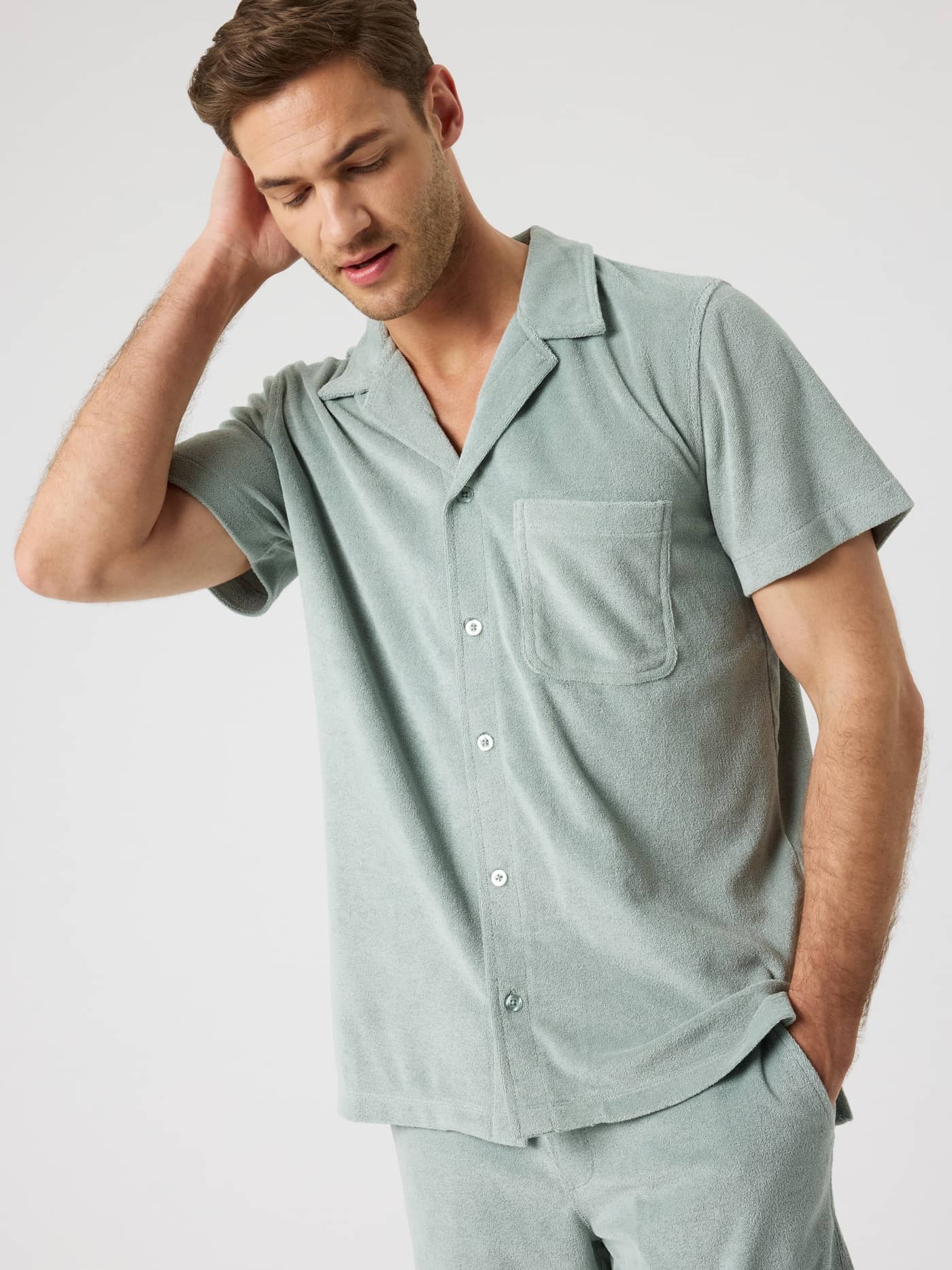 Front view of a model wearing the regular fit Borg Toweling Pool Shirt in Slate Gray (Green) with soft terry toweling. - Image 4