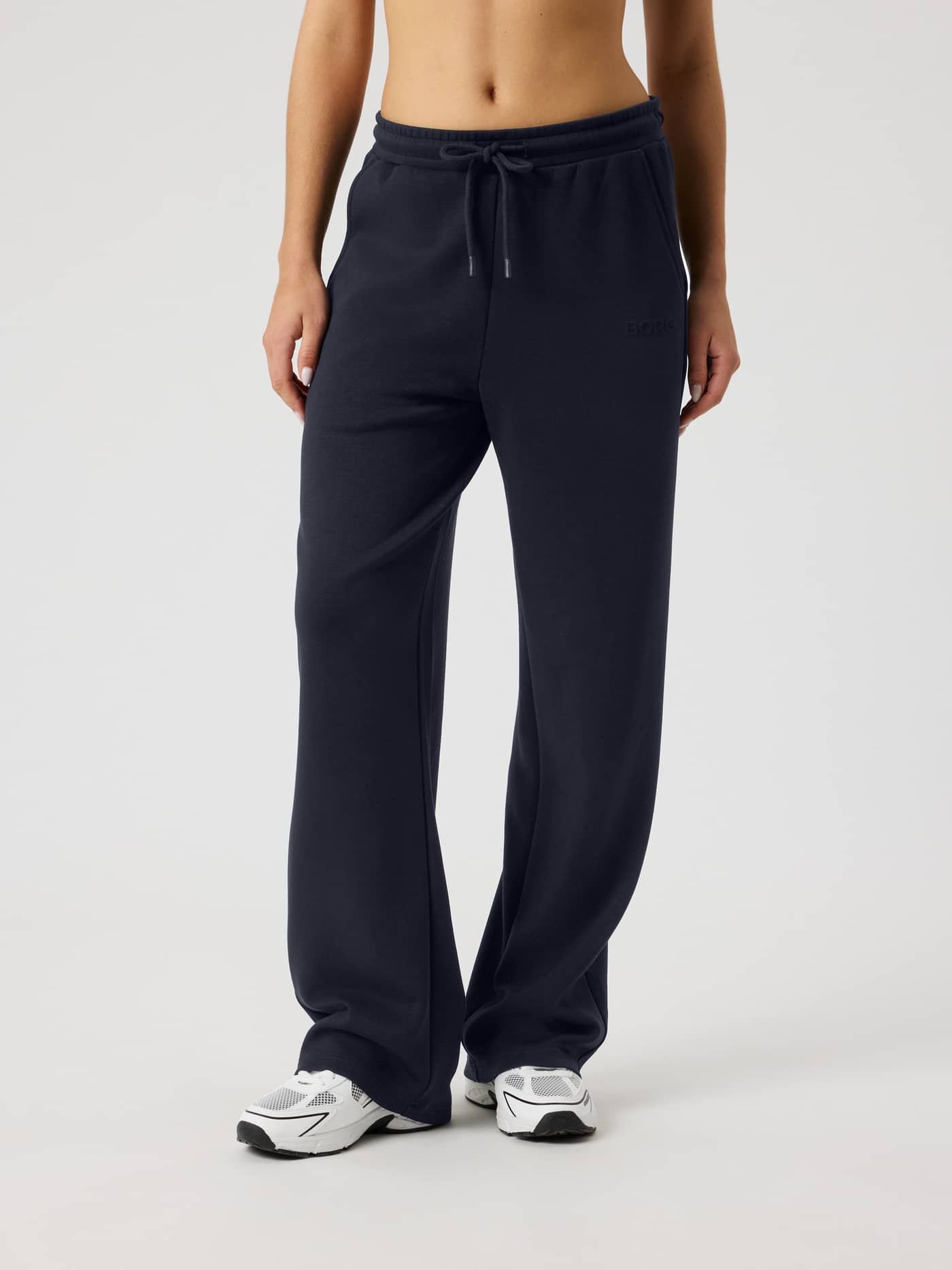 Front view of a model wearing the loose fit Studio Soft Sweatpants in Night sky (Navy), made with soft TENCEL™ Modal. - Image 1