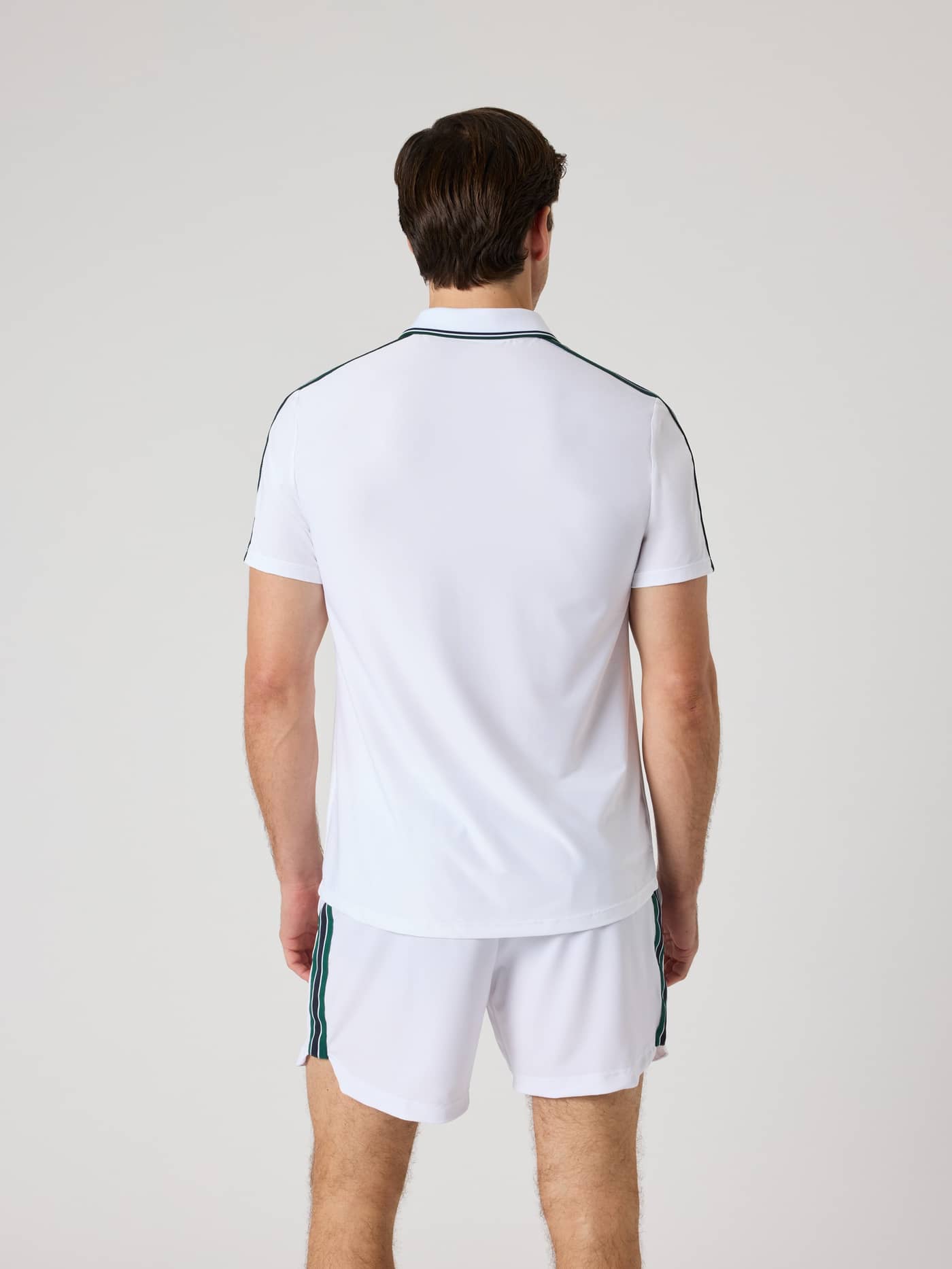 Back view of a man wearing the Björn Borg Ace Retro Polo Shirt in Brilliant White (White), designed for tennis performance. - Image 2