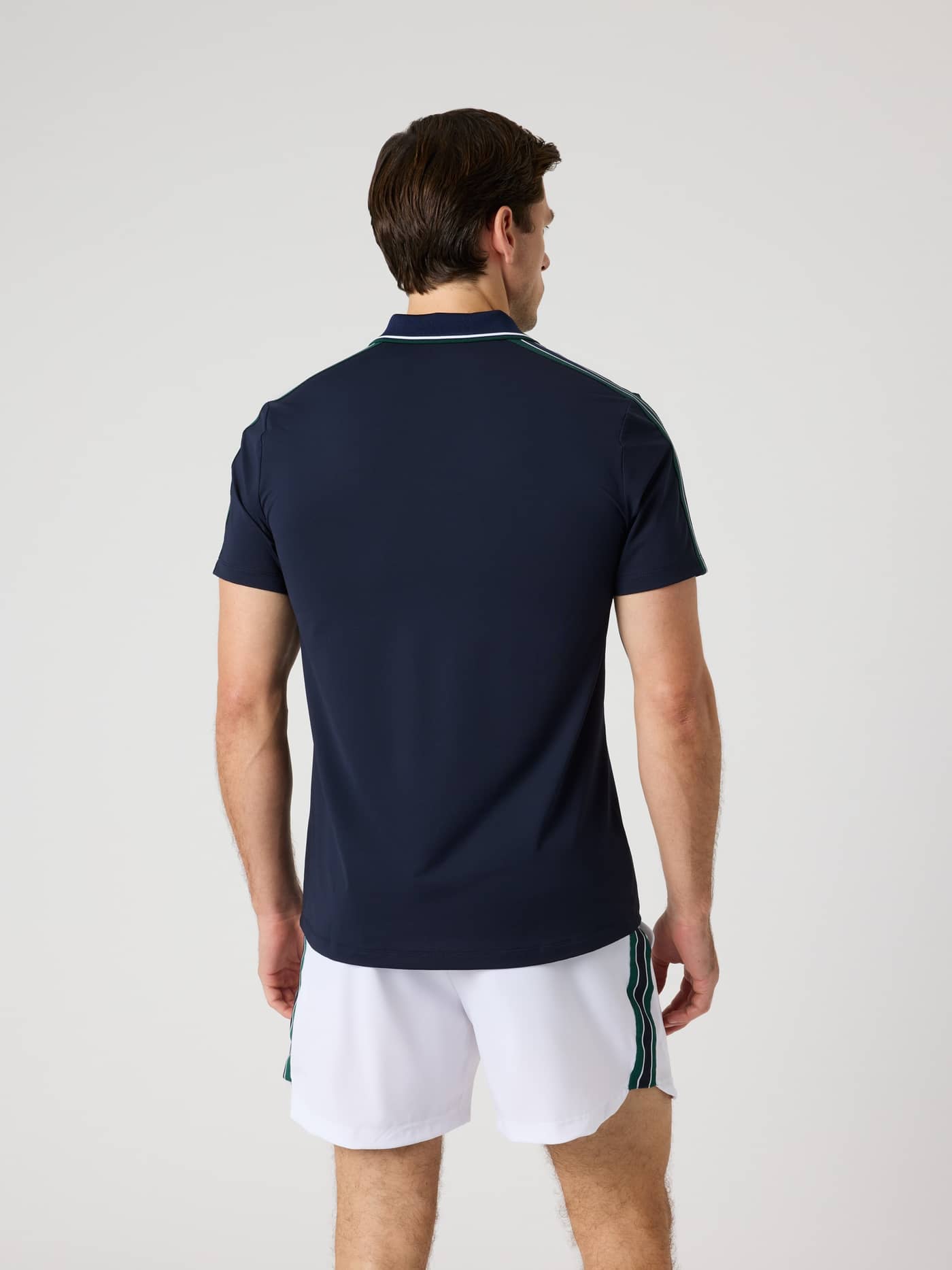 Back view of a man wearing the Björn Borg Ace Retro Polo Shirt in Night sky (Navy), ideal for tennis and active performance. - Image 2