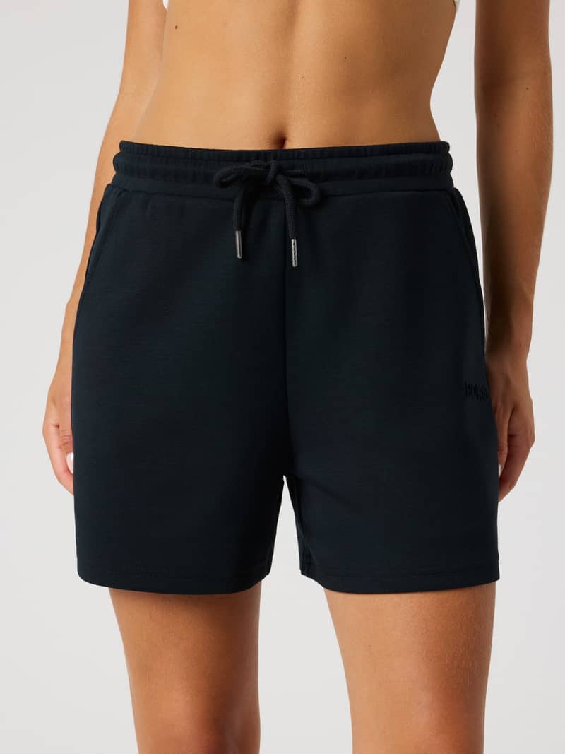 Women's Björn Borg Studio Soft Sweatshorts in Black Beauty (Black) featuring a relaxed fit and tonal logo, front view.