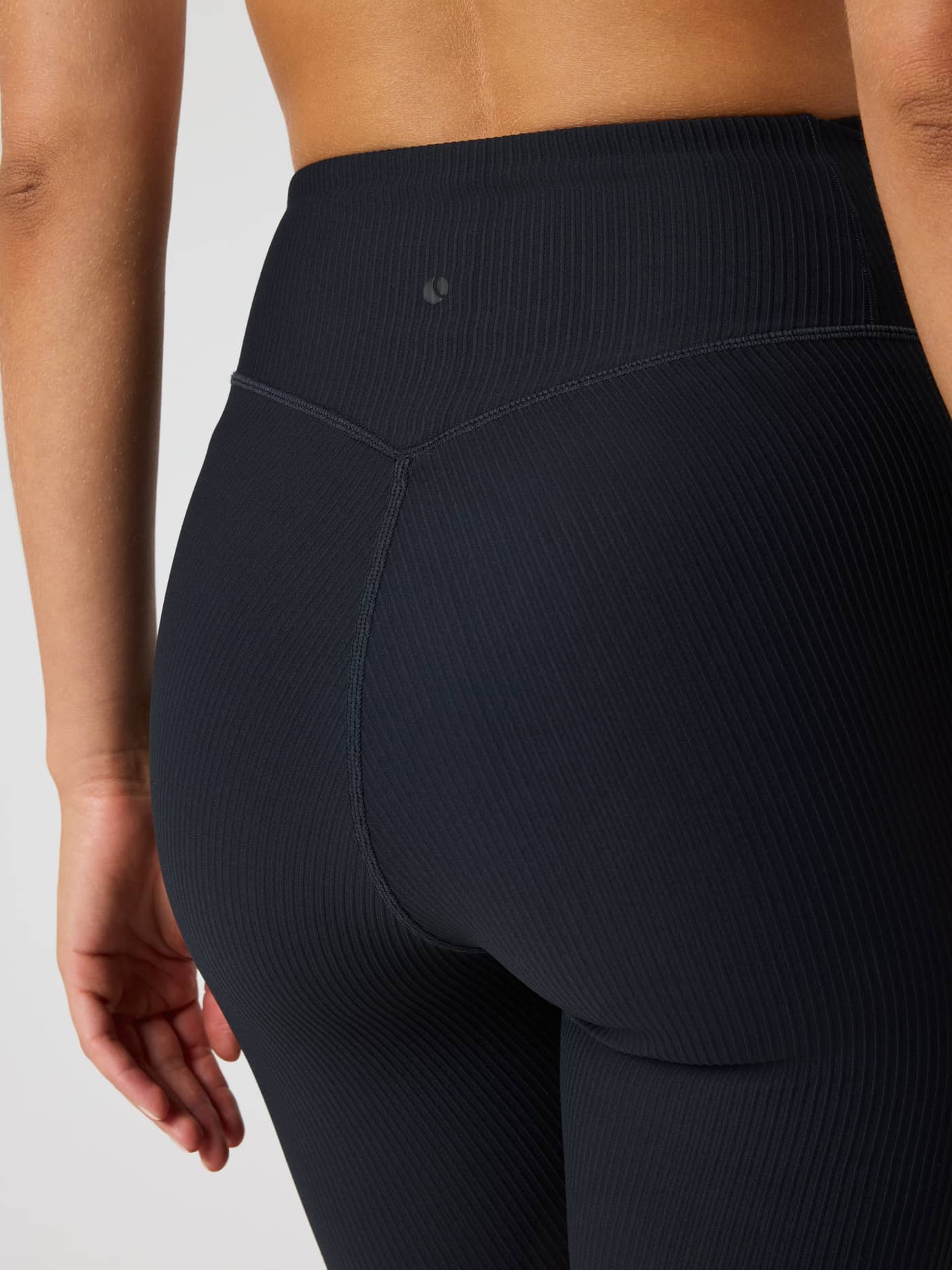 Back view of the Studio Ribbed Shorts in Black Beauty (Black), showcasing the high-waisted fit for training and tennis. - Image 5