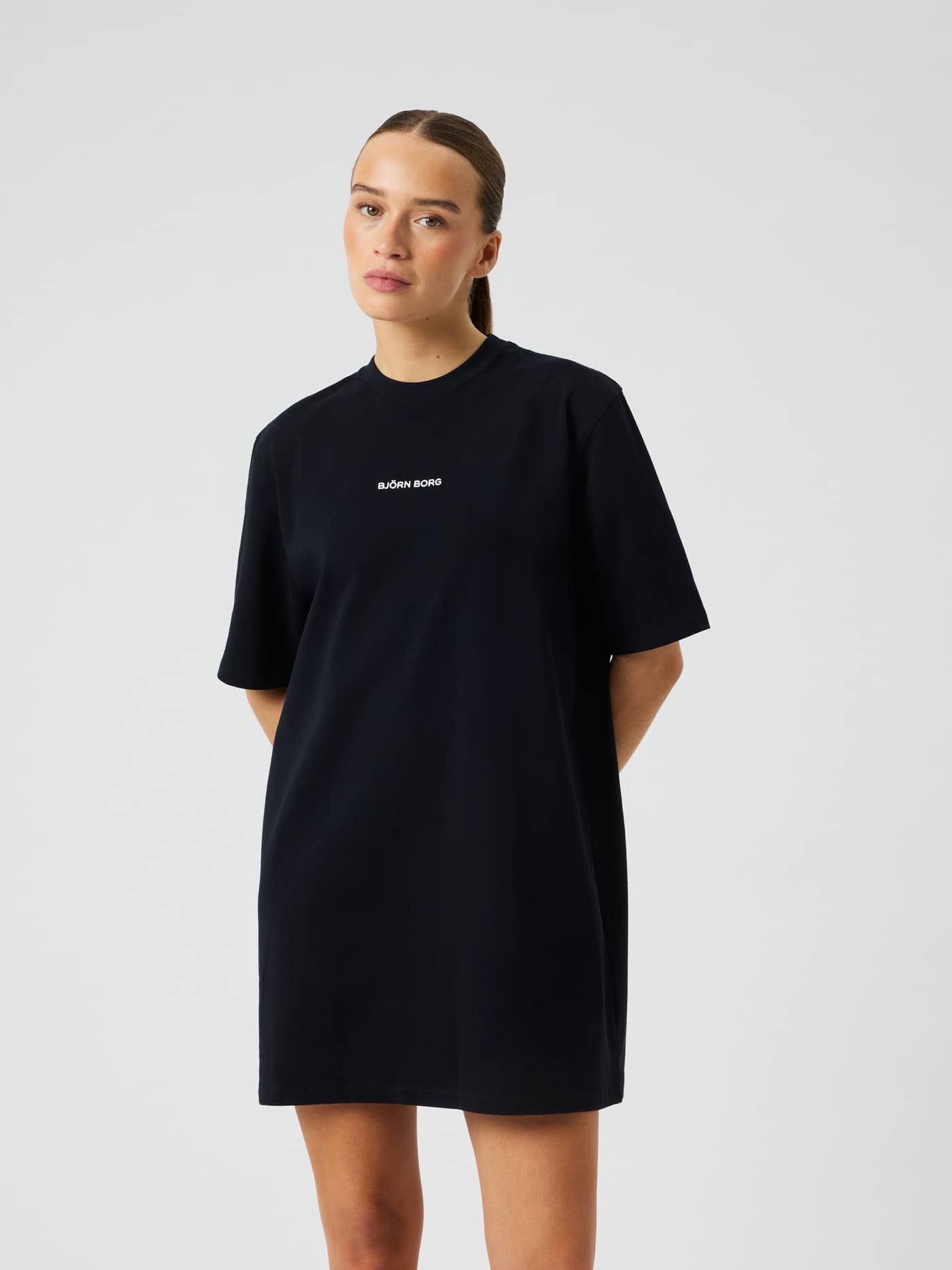 Front view of the 100% cotton Studio Oversized T-Shirt Dress in Black Beauty (Black) featuring a white Björn Borg logo. - Image 1