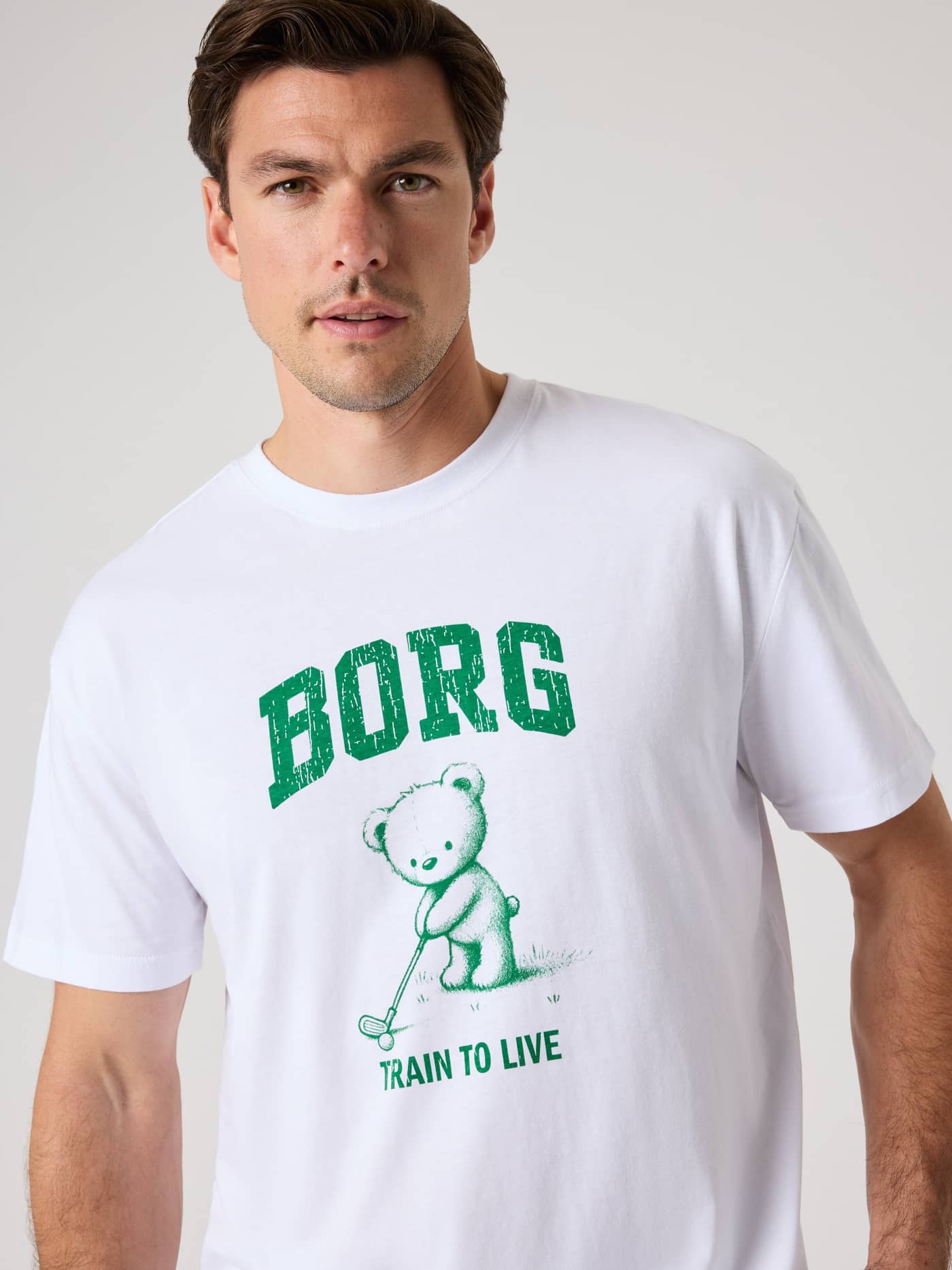 Vue de face du Borg Classic Print T-Shirt en coton Brilliant White (Blanc) avec imprimé vert de golf et d'entraînement. - Image 5