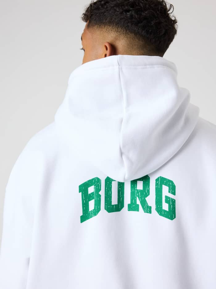 Back view of a man wearing the Borg Oversized Hoodie in Brilliant White (White) with a green logo, ideal for golf. - Image 3