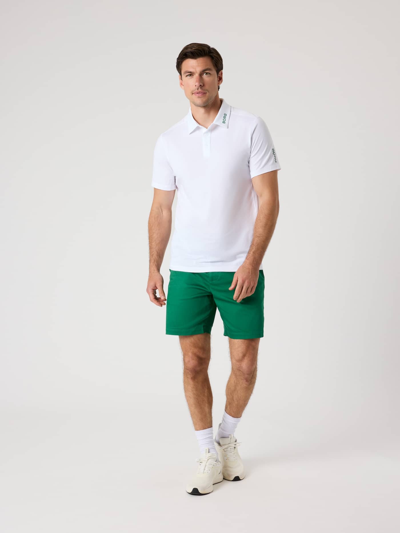 Front view of a man wearing Verdant Green (Green) Borg Golf Chinos Shorts, featuring stretchy twill for golf mobility. - Image 3