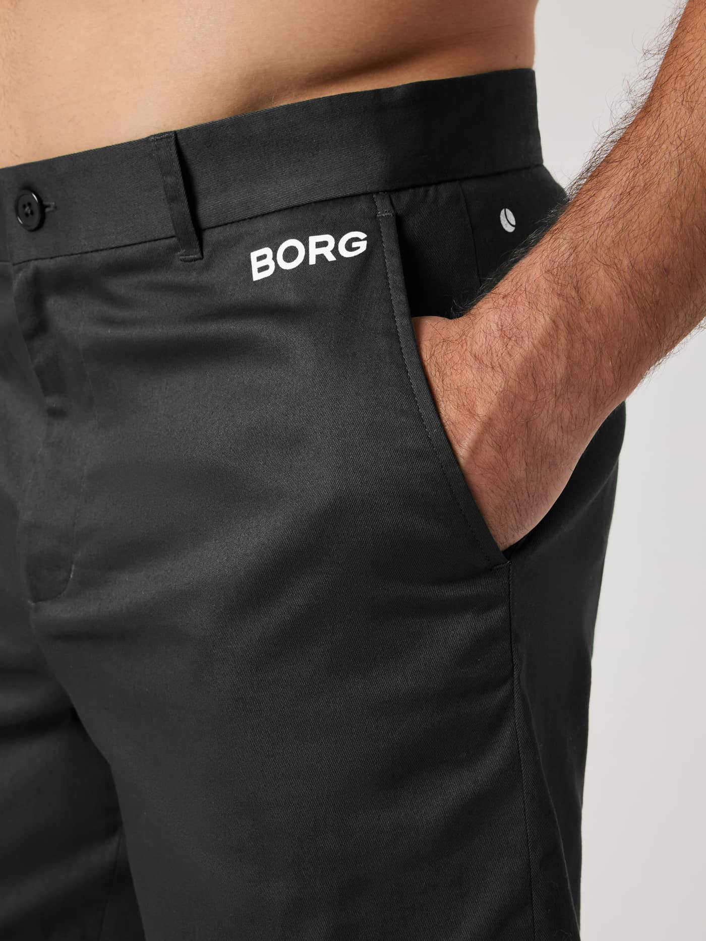 Borg Golf Chinos Shorts in Black Beauty (Black) side close-up with a white logo for functional golf style. - Image 4
