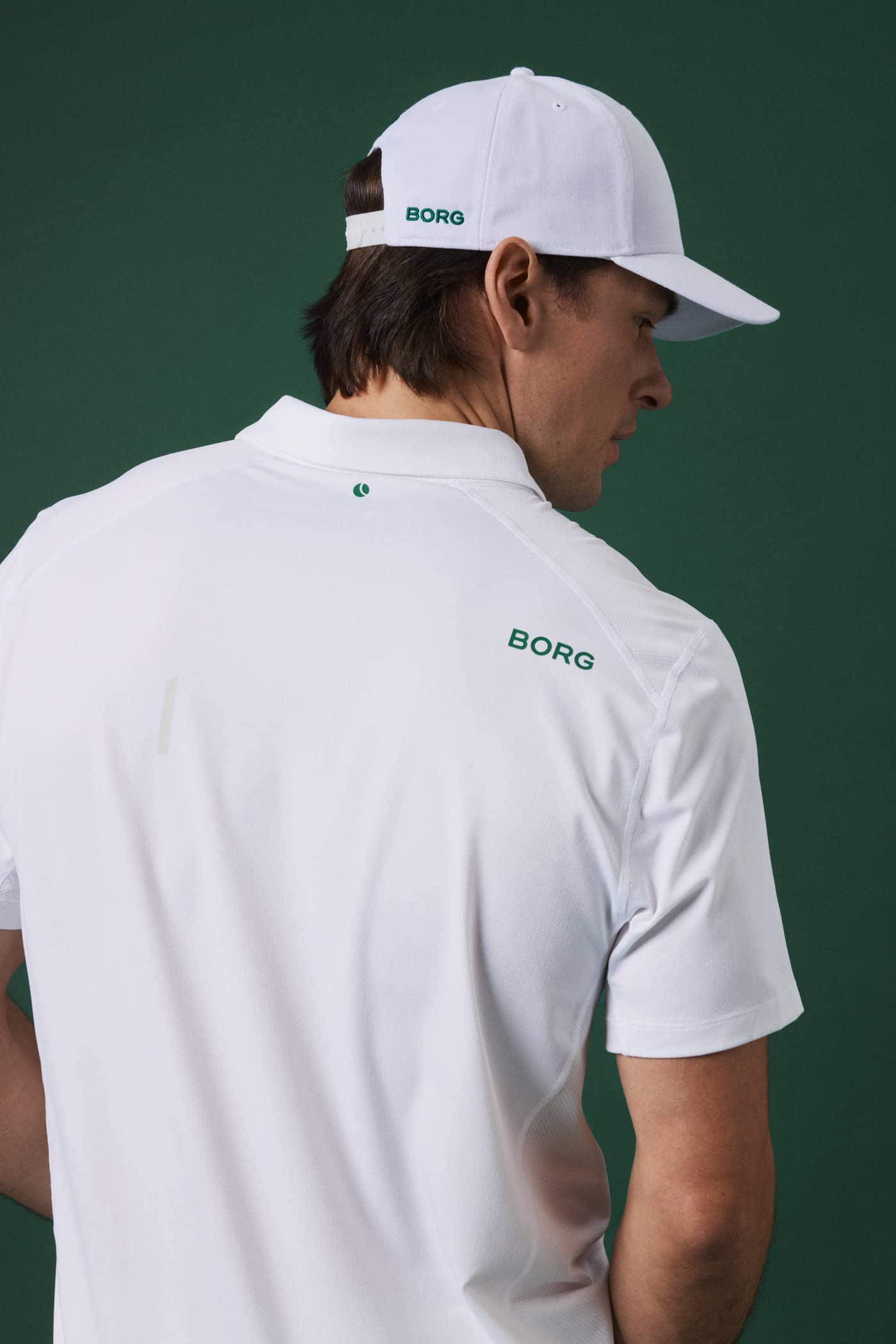 Back view of a man wearing the Björn Borg Borg Course Cap in Brilliant White (White) for functional golf style. - Image 1