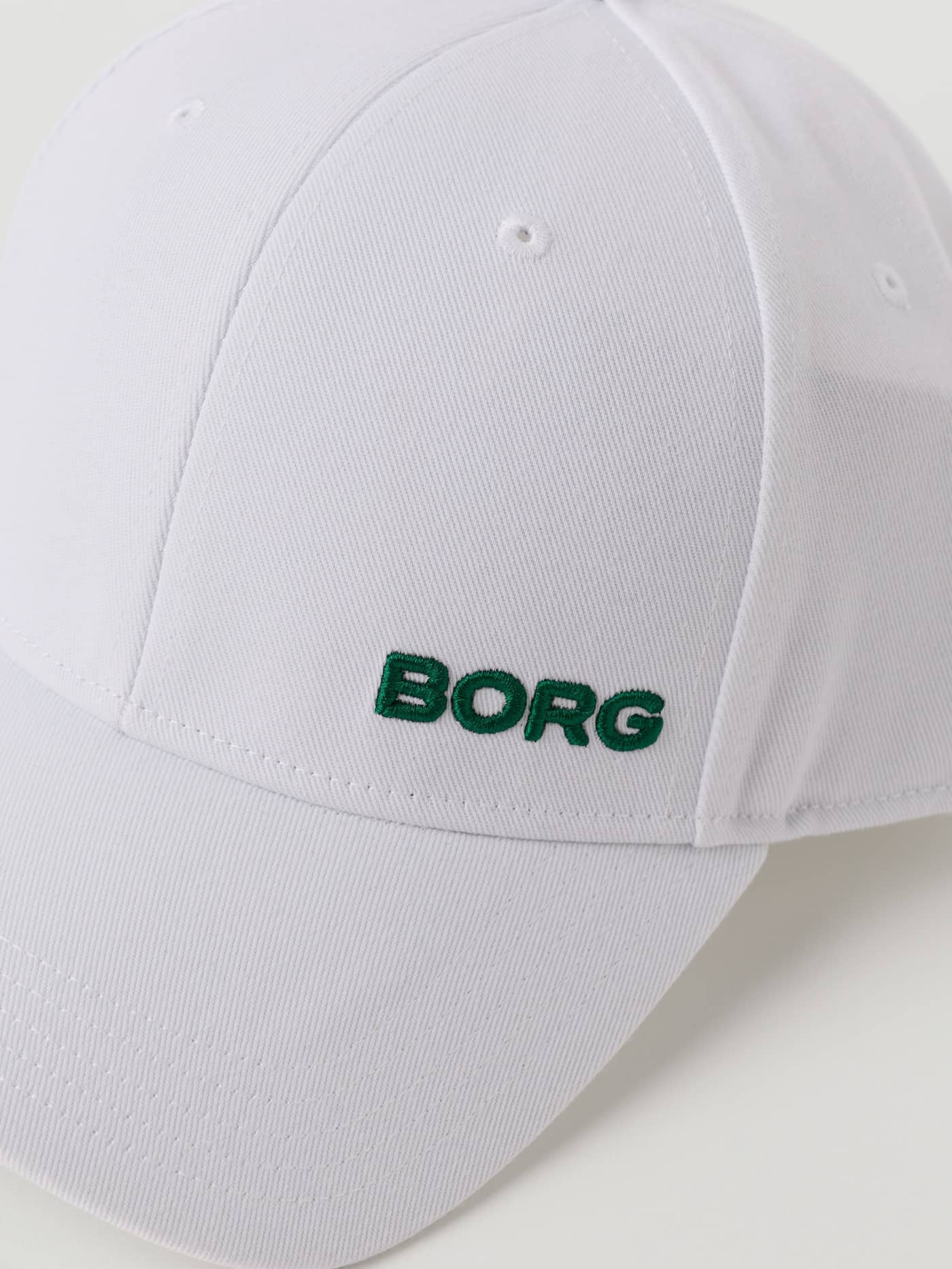 Björn Borg Borg Course Cap in Brilliant White (White) polyester with green BORG embroidery and eyelets for golf. - Image 5