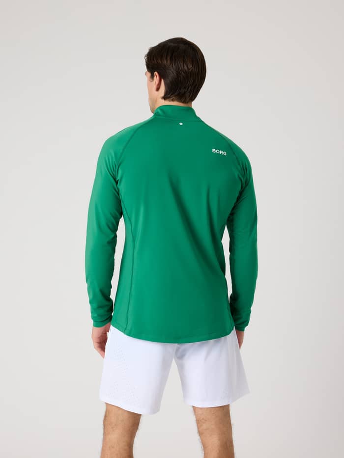 Back view of a man wearing the Borg Golf Midlayer Half Zip in Verdant Green (Green) with a white logo for golf style. - Image 2