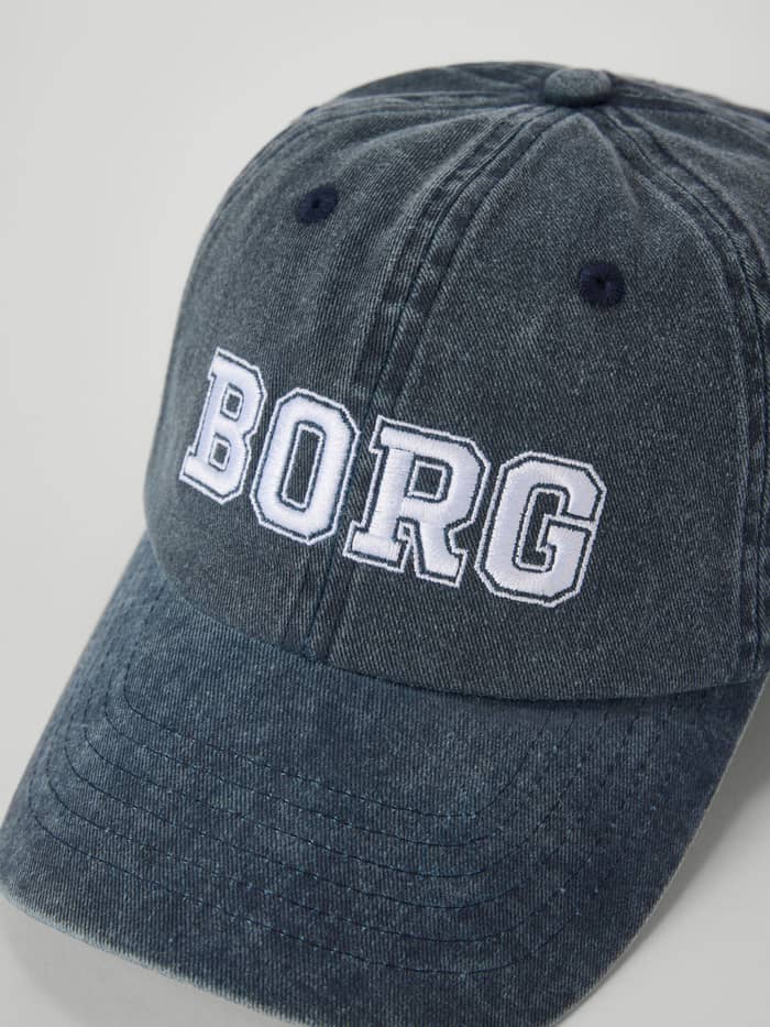 Front close-up of the Borg Washed Bold Logo Cap in Night sky (Navy) with bold BORG embroidery on washed organic cotton. - Image 3