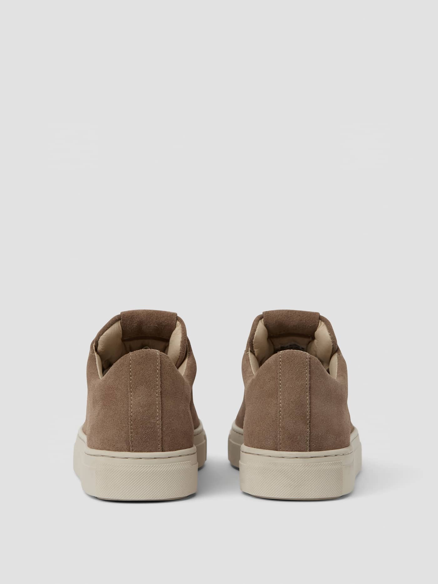 Back view of the brown Women's Classic Suede Sneakers, highlighting the tennis-inspired fit and leisure style. - Image 3