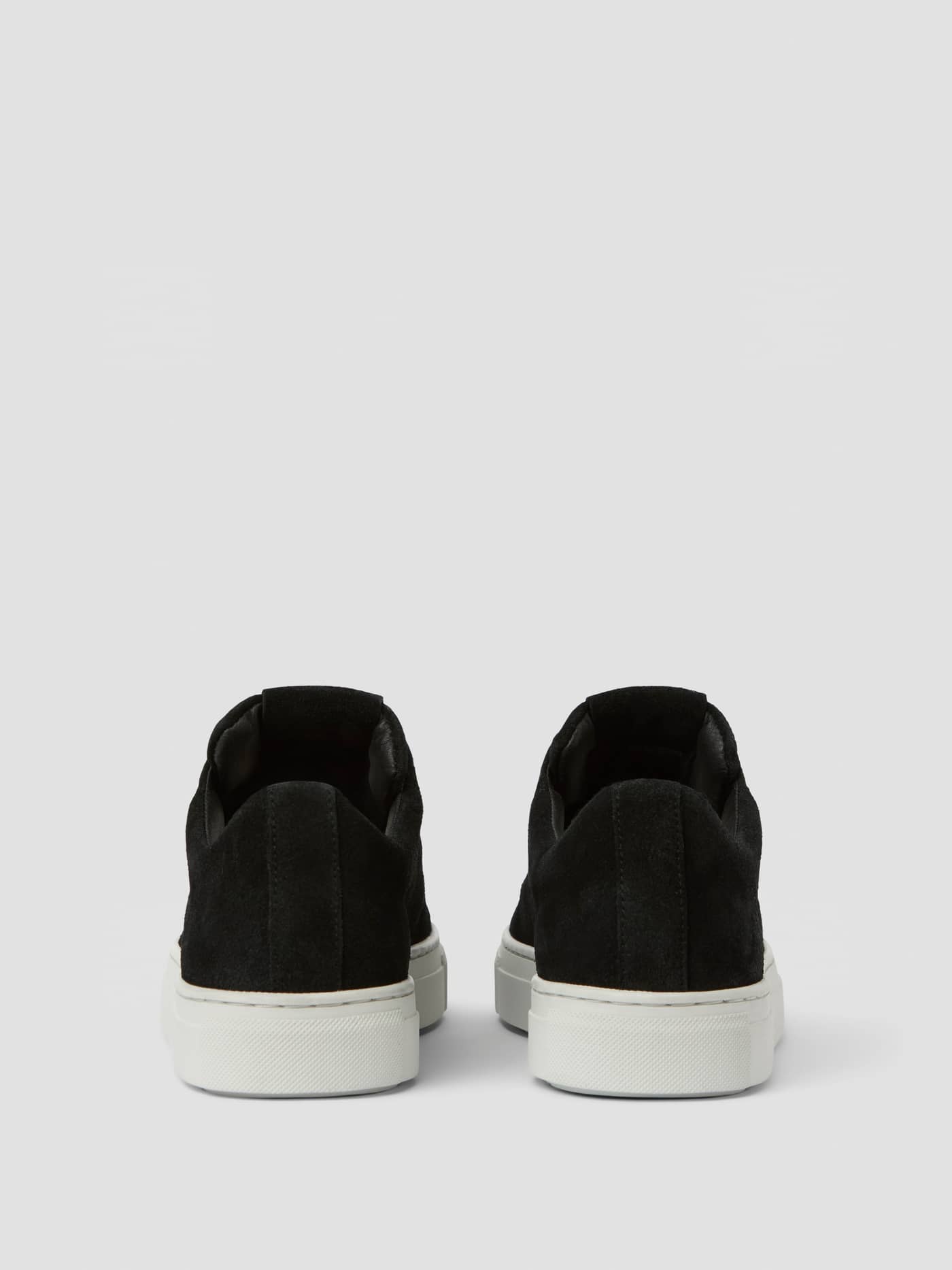 Back view of the black Women's Classic Suede Sneakers, featuring premium suede and a tennis-inspired style. - Image 3
