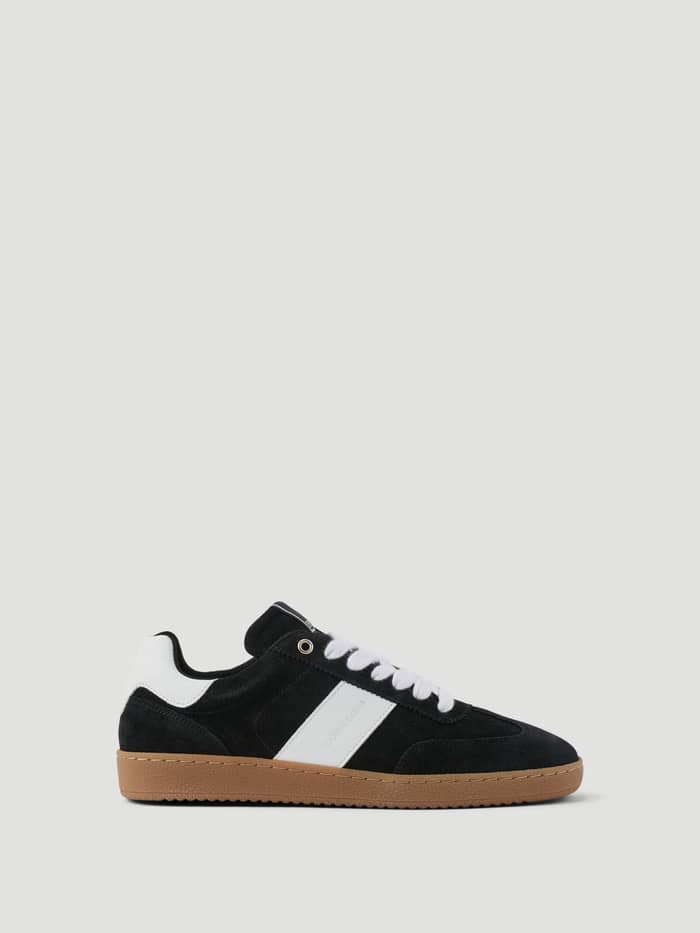 Women's Grace Leather Sneakers in black and white leather featuring a gum sole and tennis-inspired design.