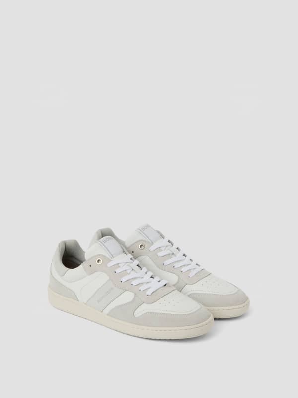Sneakers Legacy Leather pour homme en blanc 100 % cuir au design inspiré du tennis alliant style et performance.