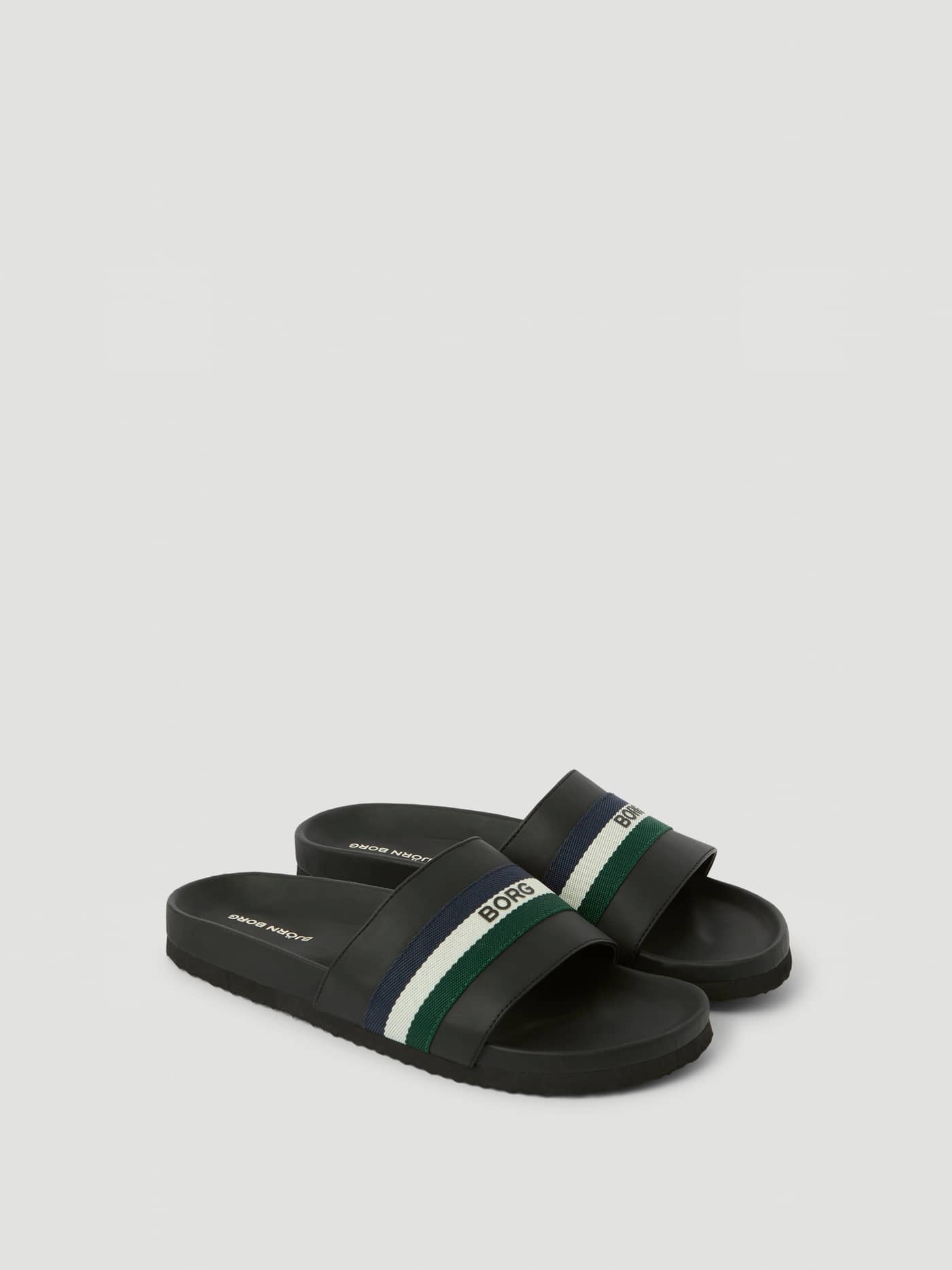 Svarta Unisex Heritage Slides i slitstark TPU med en randig rem i marinblått, vitt och grönt och svart BORG-logotyp. - Image 1