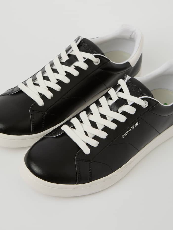 Zwarte Unisex Deuce Sneakers van synthetisch leer met witte veters en logo-accenten voor tennis. - Image 2