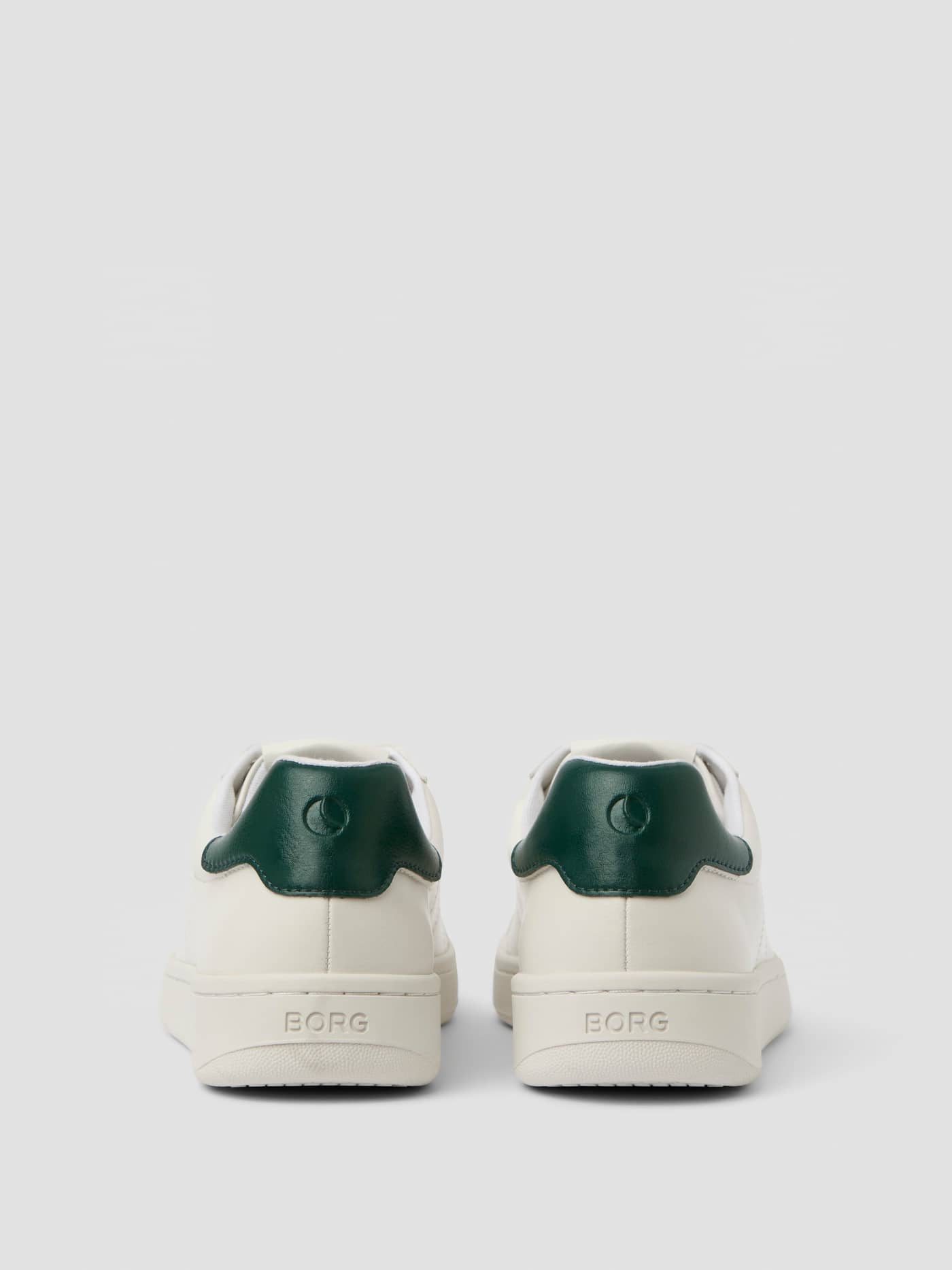 Back view of white Unisex Deuce Sneakers in synthetic leather with green heel tabs and BORG logos for tennis. - Image 3