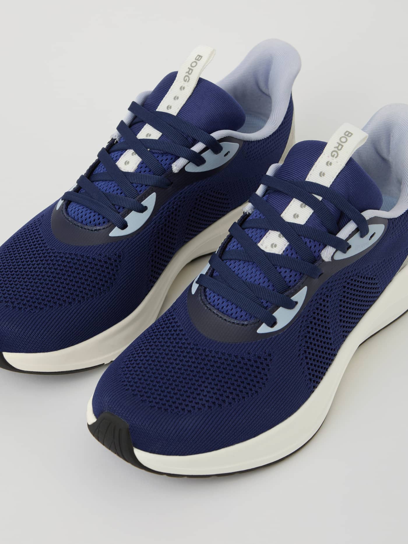 Front view of the Navy Unisex Ace Knit Sneakers for tennis and running, featuring a flexible knit upper and white BORG logo. - Image 2