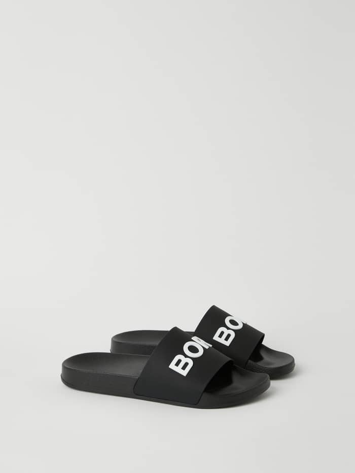 Unisex Knox Slides in Zwart van duurzaam TPU voor vrije tijd met een opvallend wit Borg-logo op de band. - Image 3