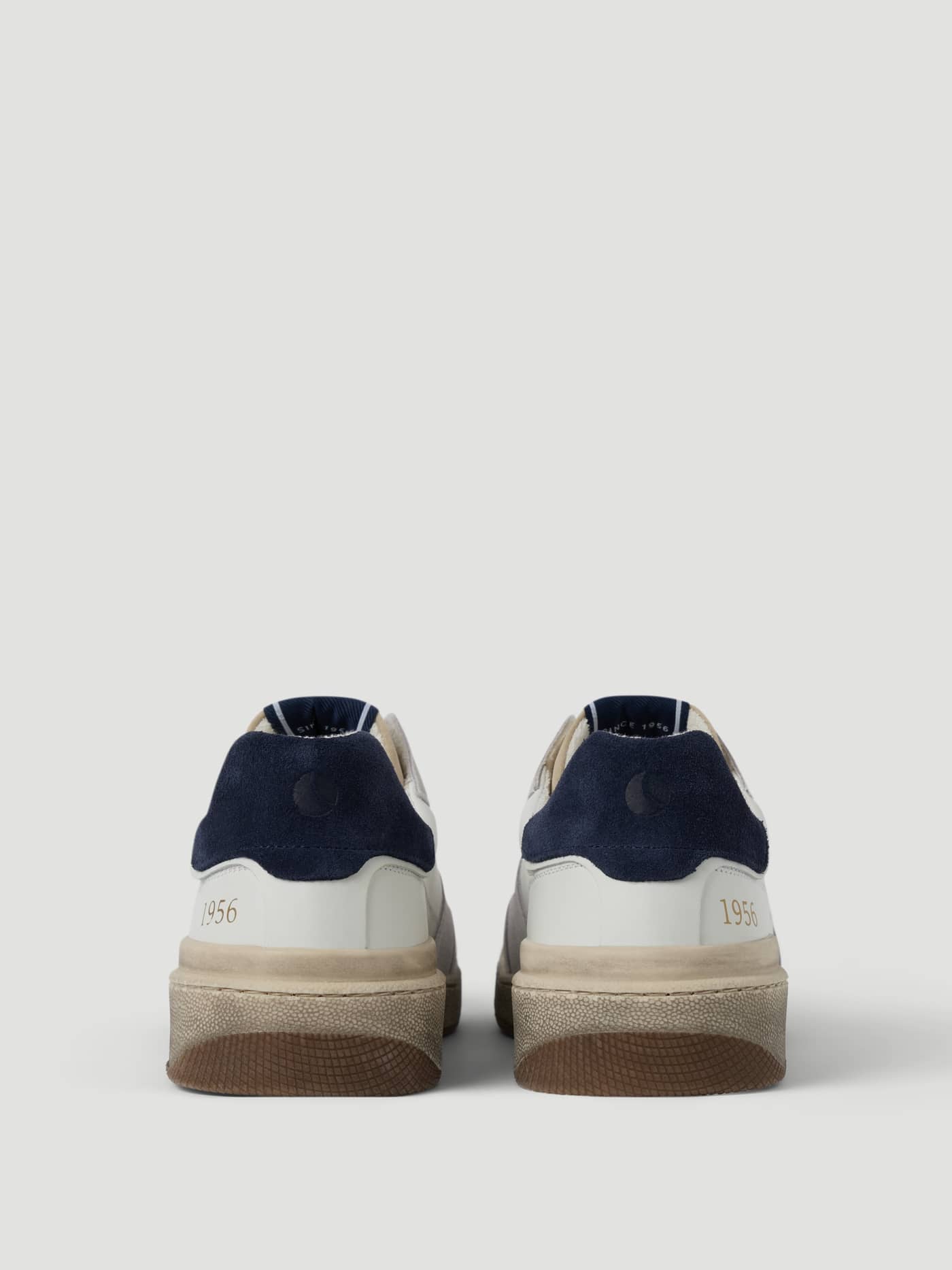 Back view of the white Men's Baseline 56 Sneakers, featuring premium leather and navy details for functional tennis style. - Image 3