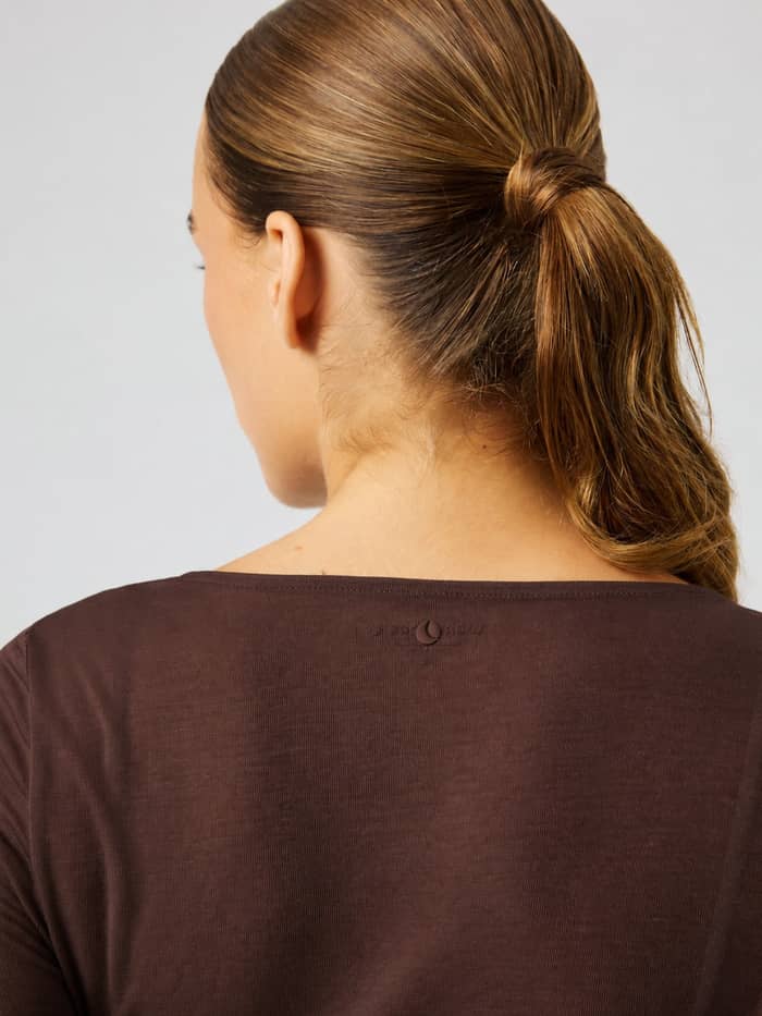 Back view of the Studio Wrapped Top in Coffee Bean (Brown) featuring a tonal logo at the neck for studio training. - Image 5
