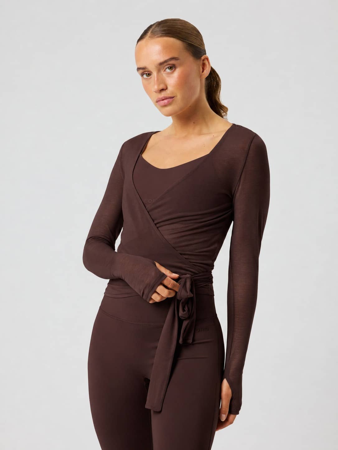 Björn Borg Studio Wrapped Top in Coffee Bean (Brown) for training, featuring a slim fit and stylish wraparound waist. - Image 2