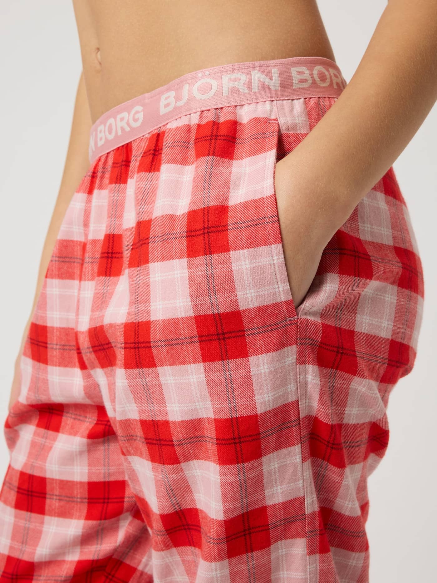 Kids' Björn Borg Core Flannel Pyjama Pants in pink, red, and white tartan with a white logo on a pink waistband. - Image 4