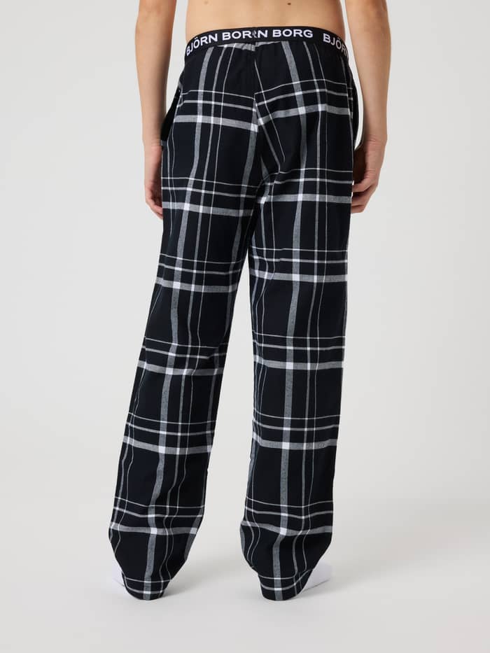 Core Flannel Pyjama Pants til børn set bagfra i sort, hvid og grå med ternet mønster og hvidt logo. - Image 3