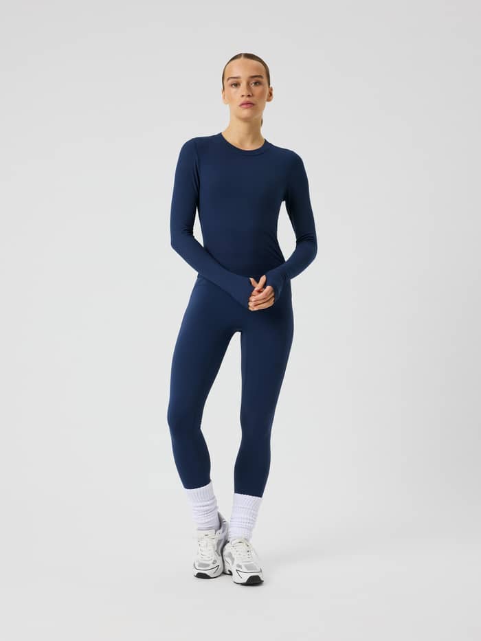 Front view of the Studio Ribbed Cropped Long Sleeve in Dress Blues (Navy) featuring ribbed fabric and thumbhole sleeves.
