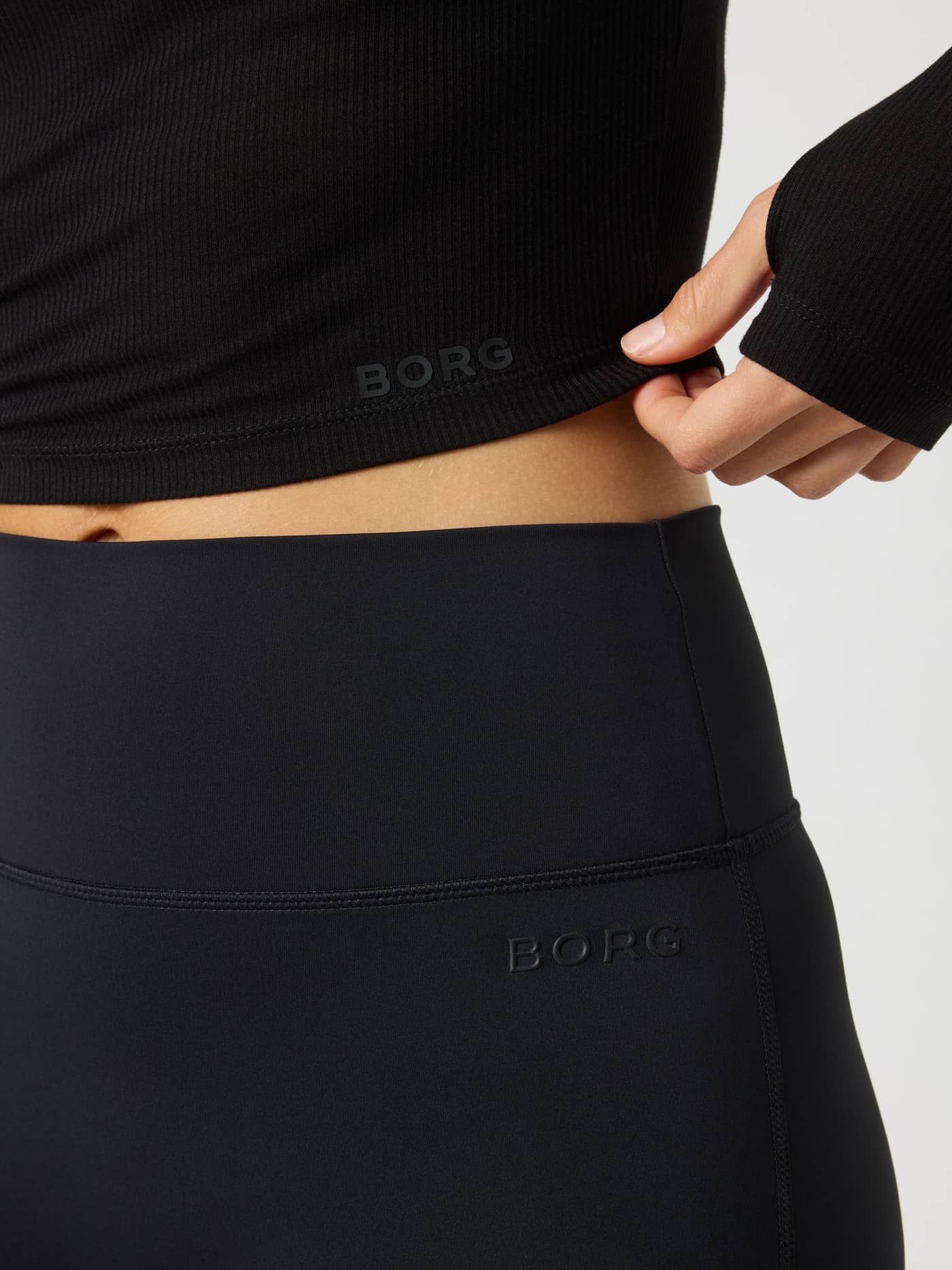 Studio Ribbed Cropped Long Sleeve in Black Beauty (Black) for training, featuring a ribbed texture and black BORG logo. - Image 5