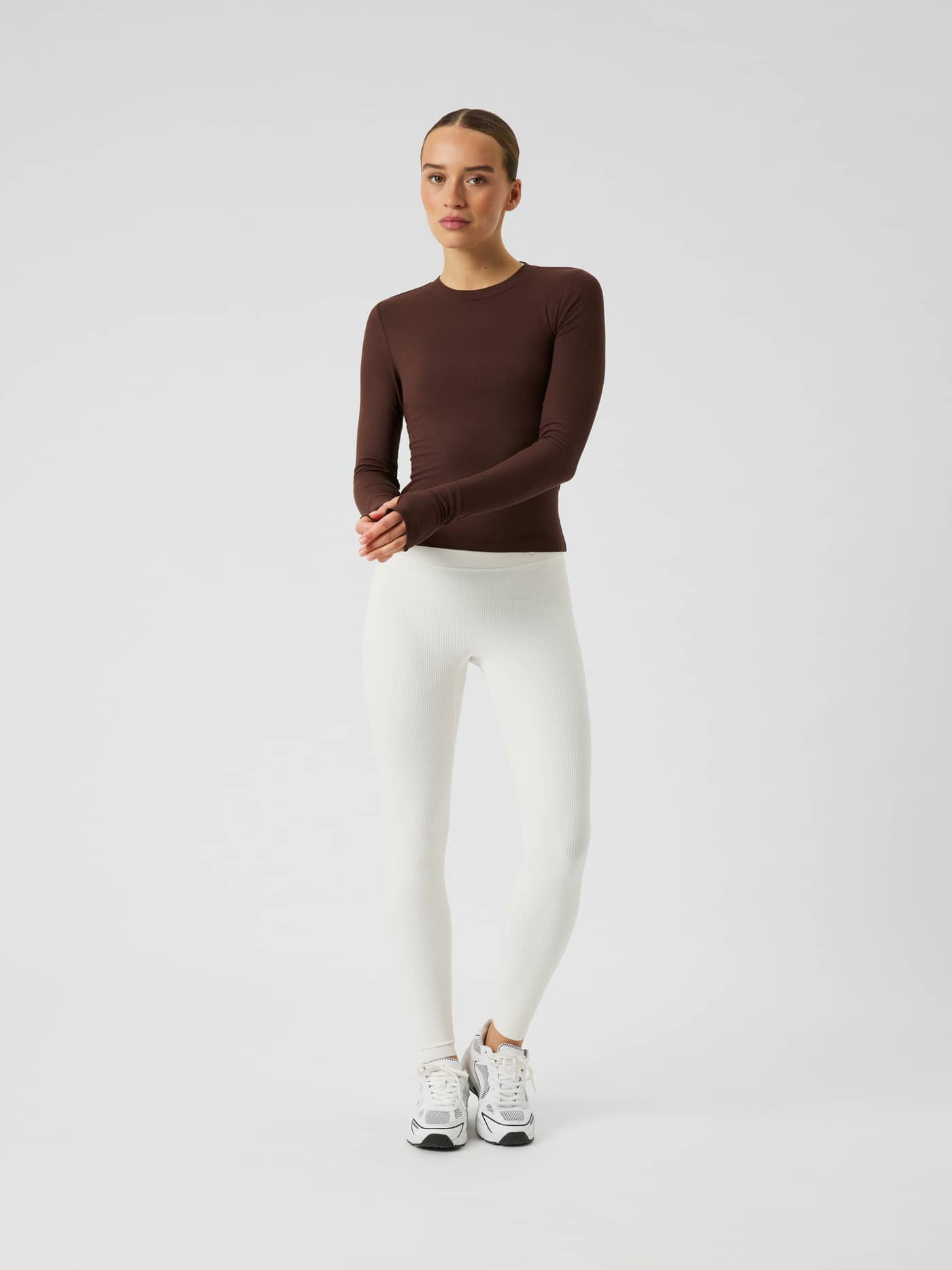 Full-body front view of the Studio Ribbed Cropped Long Sleeve in Coffee Bean (Brown) for a premium training look. - Image 3