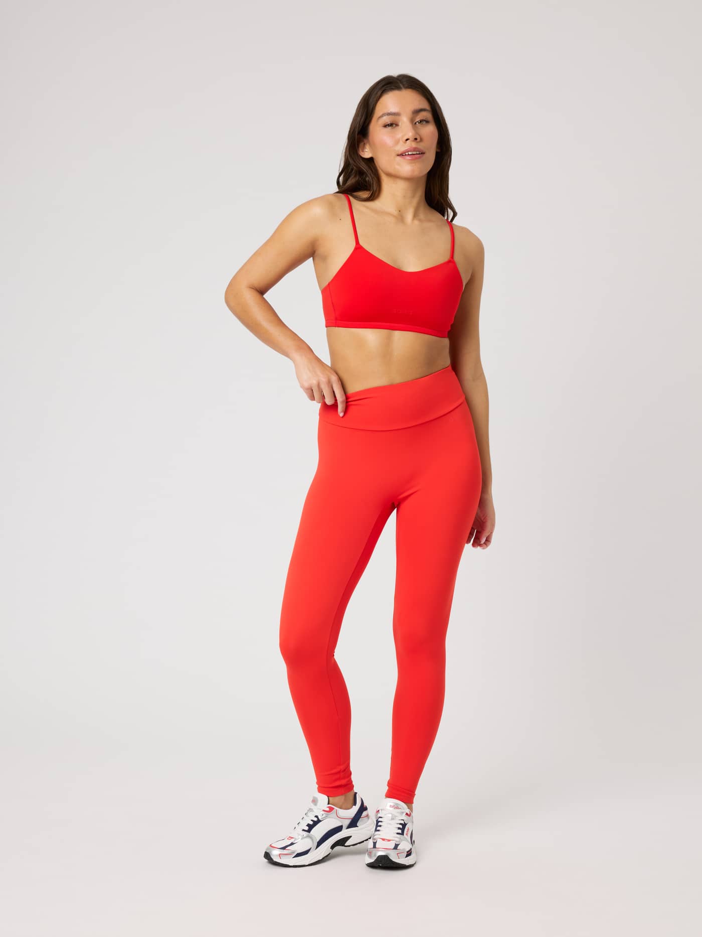 Full-body front view of the Studio Soft Tights in Flame Scarlet (Red), ideal for training and active movement. - Image 3